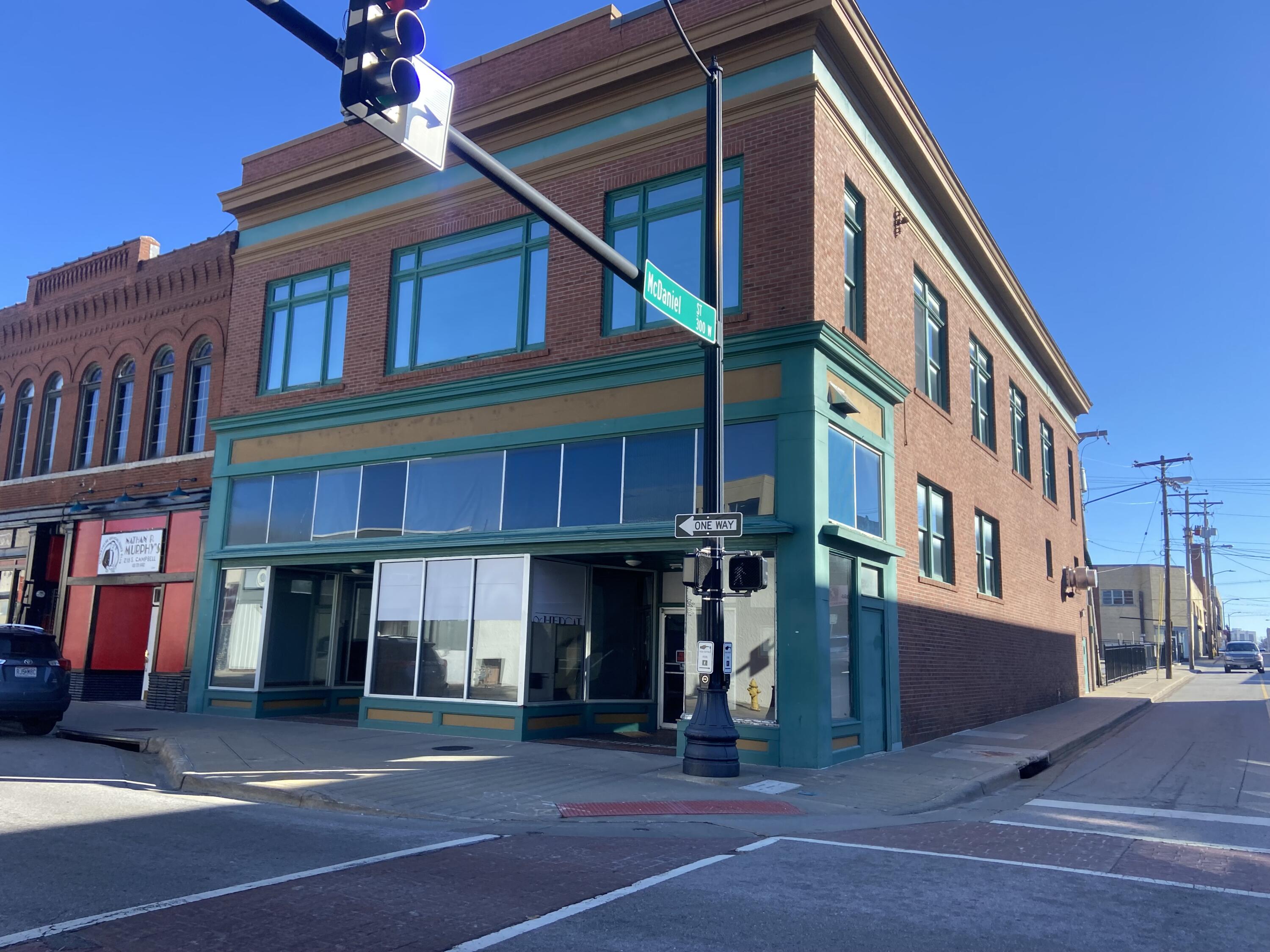 Downtown Springfield. Excellent for owner occupied/Investment property right in the heart of Springfield Missouri. Beautifully built in 1919 this 11,474 sf all brick 2 story structure with an interior mezzanine opens this main floor up to a variety of possible venues, hospitality or retail uses. Main floor is approx. 3,280 sf with 17 ft interior ceilings, 6 ft wide stair case, leading up to a 1,050 sf mezzanine. Central bar 16ft x 18ft U shaped facing 12ft raised music platform. There are 2 multi-stall restrooms. This space features a rear area kitchen with 9ft Accurex stainless exhaust  hood with Ansul Fire Suppression system, Notifier/Honeywell Fire Alarm system and 3 compartment stainless sink. Kitchen area is heated and cooled with 2 Rheem mini split systems.The 2nd level has a separate access with wide staircase leading up to wonderful approx. 3,444 sf open office space consisting of 12ft ceilings, concrete flooring, 2 restrooms (1w/ shower), carpeted conference room, kitchen area with counters and cabinets. This space is beautifully lit with hanging glass fixtures and enhanced with dual wood trimmed skylights for additional daytime illumination.Partially framed 3,280 sf basement for large storage area. This space has dual access stairways, Rinnai tankless gas water heater and a Great Basin grease interceptor. Entire basement is water sprinkled. Perfectly positioned at the intersection of Campbell Ave and McDaniel St amongst many office and retail businesses: Pension Consultants, Campaignium Marketing, Moxie Theater, Kai, Flame Steakhouse, Blue Room Comedy Club and Springfield Brewing Company just to name a few.