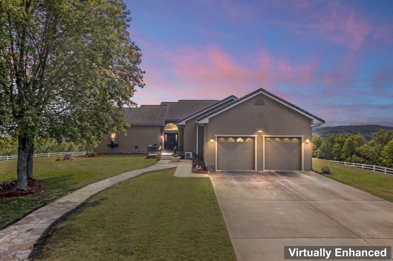 Price Reduction Alert! This home is priced to sell quickly. Don't miss out on this incredible opportunity!Introducing a luxurious mountain retreat in the heart of the Ozarks! Located just 11 minutes from Branson and 35 minutes from Springfield! This 5-bedroom, 4-bathroom home boasts stucco siding, a classic clay tile roof, and metal framing. Upgrades include a newly replaced clay tile roof and ongoing bathroom updates, adding modern touches to complement the home's timeless design. Over $100,000 in upgrades!  Sitting atop a sprawling 38.19-acre estate, this property offers unparalleled privacy and breathtaking panoramic views of the Ozark Mountains. The property is surrounded by beautiful electrical vinyl fencing. As you approach, the long, impeccably paved driveway welcomes you to your own secluded paradise. In the timber, you will find a natural spring.This 6,129-square-foot residence features an open concept design that seamlessly blends the interior with the picturesque surroundings. Ample windows flood the space with natural light, accentuating the home's beauty.Step outside onto a generous deck that spans the length of the home, offering the perfect setting for outdoor entertaining or simply soaking in the tranquil mountain scenery.The walk-out basement reveals a spacious recreation room with a large wet bar, and a wine room providing a fantastic space for gatherings. With metal framing replacing traditional wood, this was built to withstand the test of time. Don't miss your chance to own this one-of-a-kind mountain estate, where luxury meets the serenity of the Ozark Mountains. This is a truly unique opportunity.Additional acreage also available! 10, 10, and 6.8 acre tracts. See MLS # 60261300, 60261302,  60261301