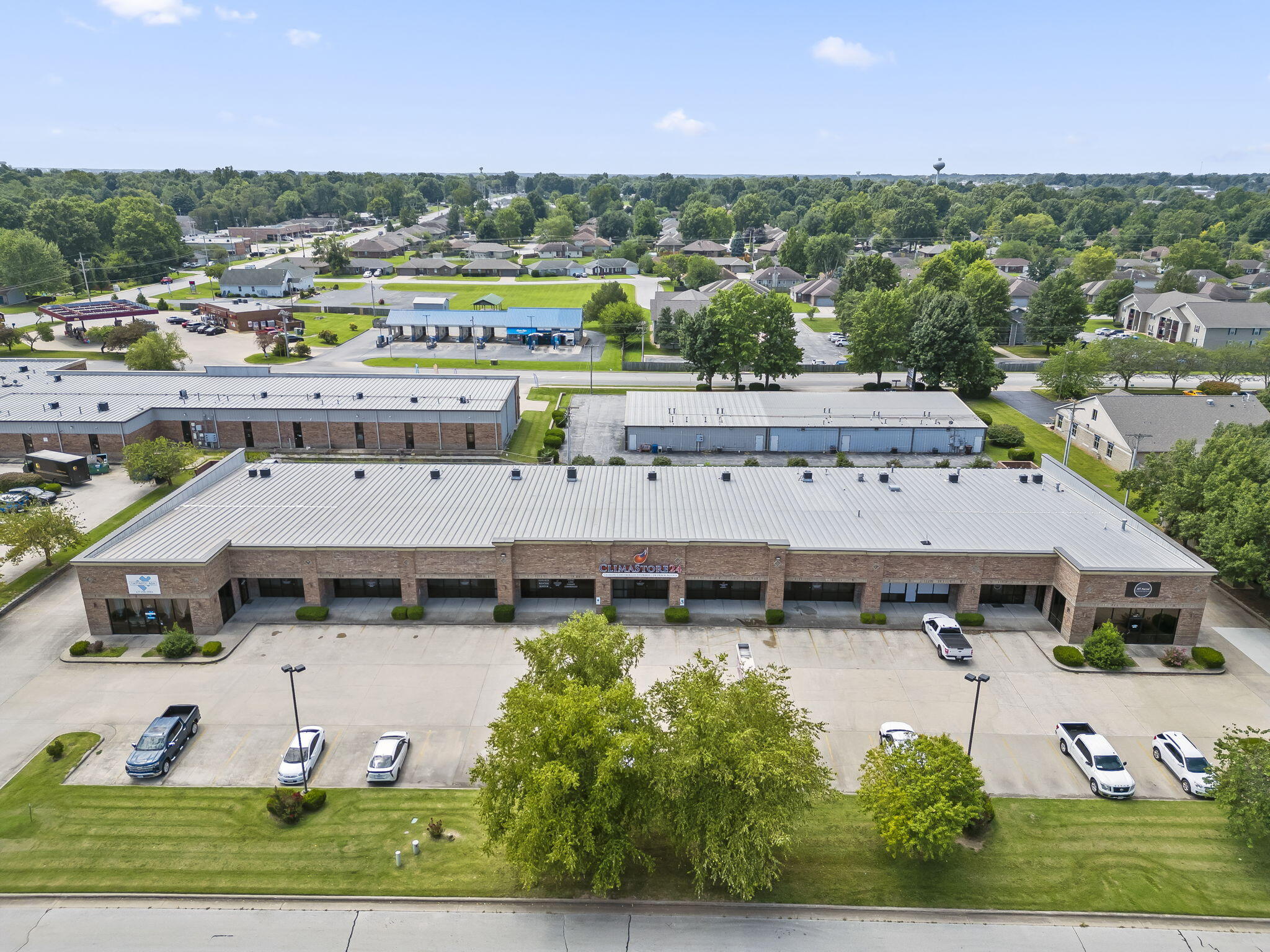 The search stops here! Check out this premier commercial real estate opportunity in Nixa, MO! We proudly present a 20,000+ square foot strip center situated on Sherman Way, boasting an impressive 336 feet of road frontage on 1.61 acres of prime ''Highway Commercial'' zoned land. This strategic location offers excellent accessibility, with a convenient distance to Springfield, MO, making it ideal for businesses looking to tap into a larger market. Nixa itself enjoys a vibrant community with a population of over 26,000, complemented by the broader customer base of Christian County (population 95,000+).The property features a total of 11 rental spaces. Among these units is a standout 11,550 square foot space (7 combined rental units) housing a thriving indoor climate-controlled storage facility--a secure and profitable business that is included in the sale of the property.There are currently 3 other tenants (2 that occupy one space and 1 that occupies two spaces) in the  building. One lease expires in July of 2027, One expires in June of 2025 and one ends in 2026.All three additional tenants have expressed interest in signing additional lease agreements after theirs expire which will ensure stable rental income for the future owner. This property was built to last with steel frame clear span construction on a concrete slab with 15' eve heights. The roof covering is raised seam pre-finished steel panels with a single slope design extending over the covered front sidewalk. Each unit has a commercial glass front consisting of aluminum framed fixed plate glass windows and aluminum framed plate glass doorways. Each unit has an insulated rear doorway set in a steel jamb (unit 11 also has a 10 x 10 overhead door accessing the rear of the unit) The exterior finish of the building has brick veneer along the front and sides with the rear of the building having a raised seam steel panel exterior and each unit is individually heated and cooled by their own system.
