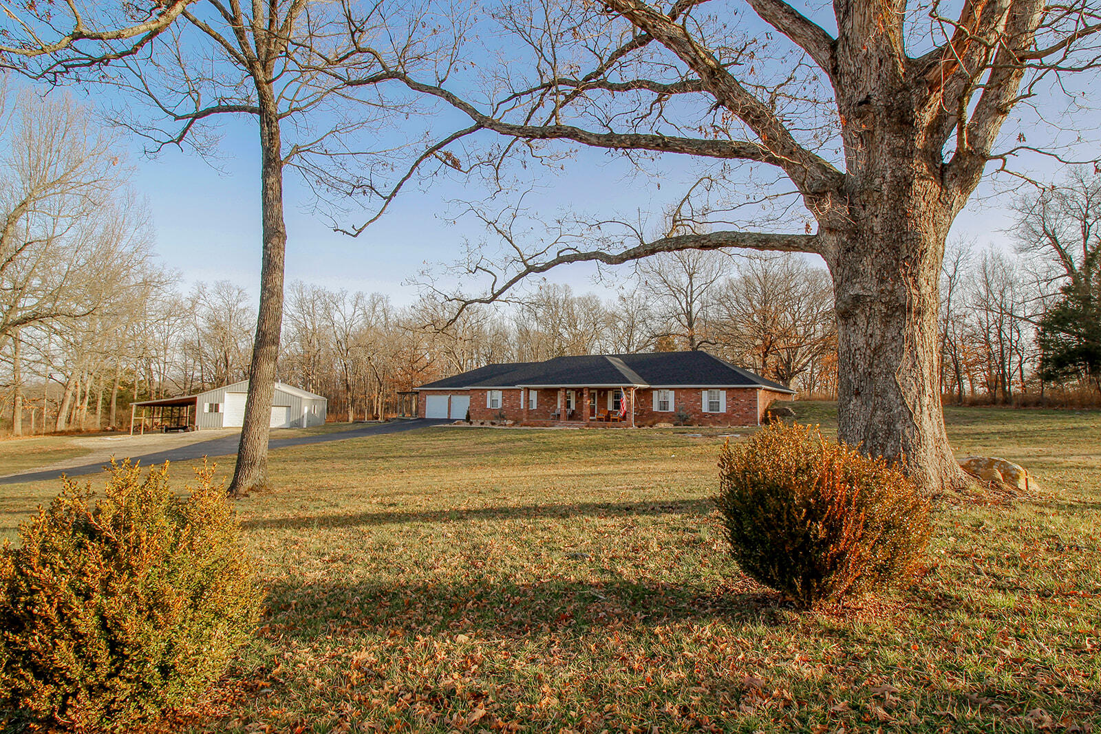 WOW!!! What a Property and What a Location! This gorgeous earth-berm home sits on 3.21 acres just outside of town giving it a peaceful country setting with all the benefits of living close to the city! Schools in very close proximity to this property! Nearly 2,700 sq ft of living space with 3 bedrooms, 2.5 bathrooms, and a bonus room that is currently being used as a 4th bedroom! The home has an open floor plan and boasts a ton of great features including a new roof put on in 2021, granite countertops, alder wood soft close custom cabinets, stainless steel appliances, beautiful tile floors, UV water filtration system, a large master bathroom with a garden tub, double vanities and a walk-in shower, tray ceilings throughout the home, walk-in closets, skylights in living room with sliding blinds, and many more updates throughout the home! Extremely energy efficient with electric bills averaging around $115/month! Lots of porch space outside for sitting or entertaining guests. Newer landscaping! The SHOP is Heated and Insulated and has over 1,300 sq ft with 220 Electric and an excellent work space inside! Two overhead doors with a lean-to as well. Asphalt driveway that was re-sealed in '21! This property truly has a park-like feel to it with lots of open space, mature trees, and wildlife! The list goes on and on with this beautiful property!!!