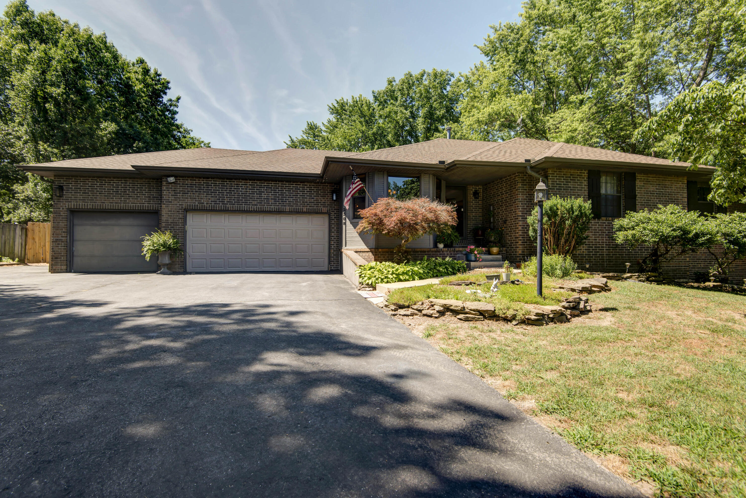 This stunning walk-out basement home is nestled on 1 acre right off Evans Road, just outside of Springfield near Springfield Lake. You will love the in ground pool, backyard landscaping, and pond with goldfish, giving you the feel of your own paradise! This 4 bedroom, 3 bathroom, 3 car garage home is waiting for you. As you enter you can feel the openness and warmth. The kitchen features stainless appliances, granite counters, and stone backsplash...all new within the last year. The Master suite includes a spacious bedroom, new blinds, granite counters, upgraded toilets and sinks, walk-in closet, and a jet tub. The fully finished basement offers 2 additional non-conforming bedrooms that could be used as an office or workout space. Off the downstairs living area you will find a sunroom leading out to the backyard. You are sure to enjoy entertaining on your brand new deck, poolside, or just relaxing and soaking up your new paradise! Pool has a new liner added in 2021. Roof and gutter guards are less than 2 years old!
