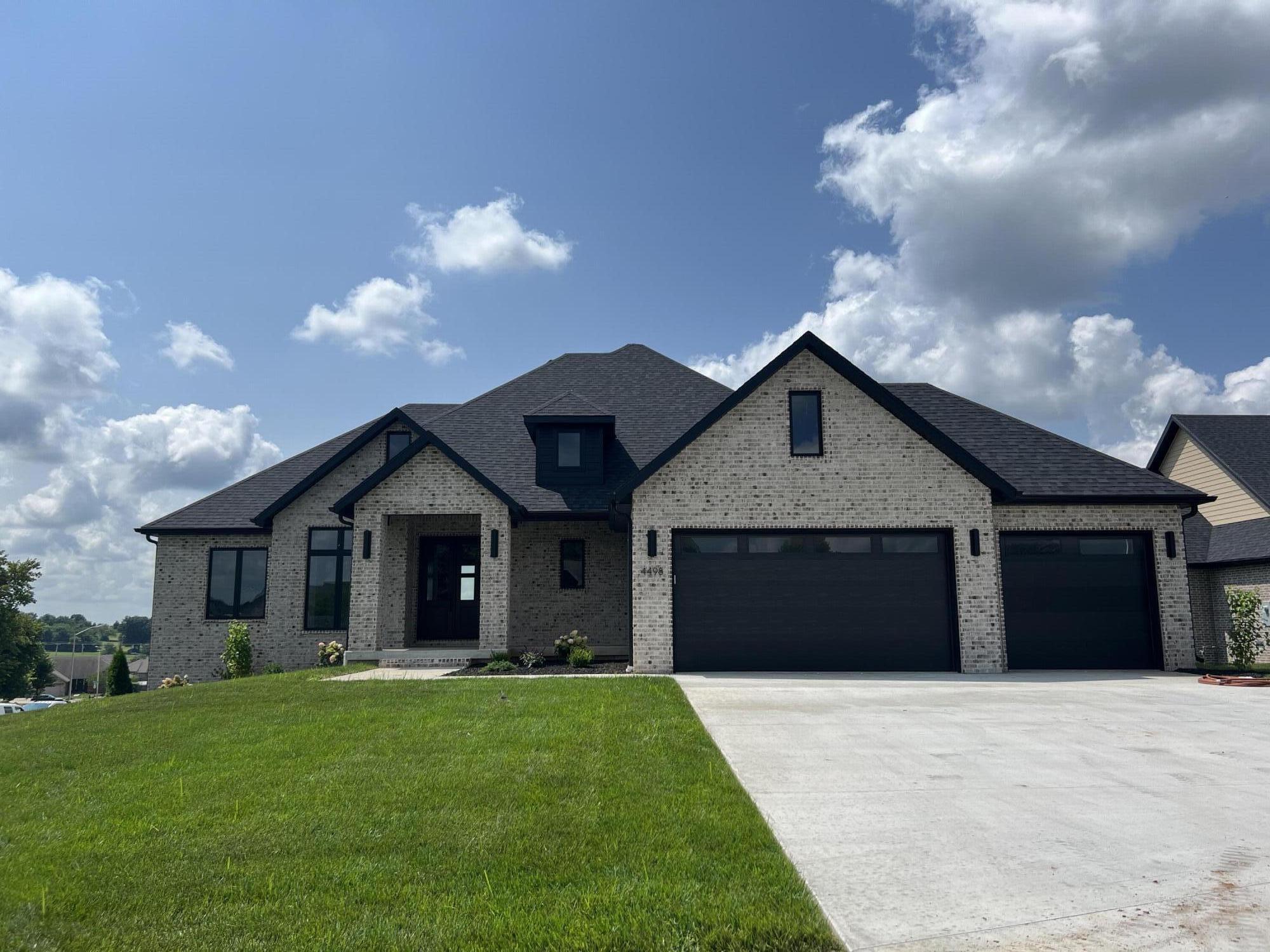 Walk out basement. 5 bedrooms, 3.5 baths, 2 living areas. All brick