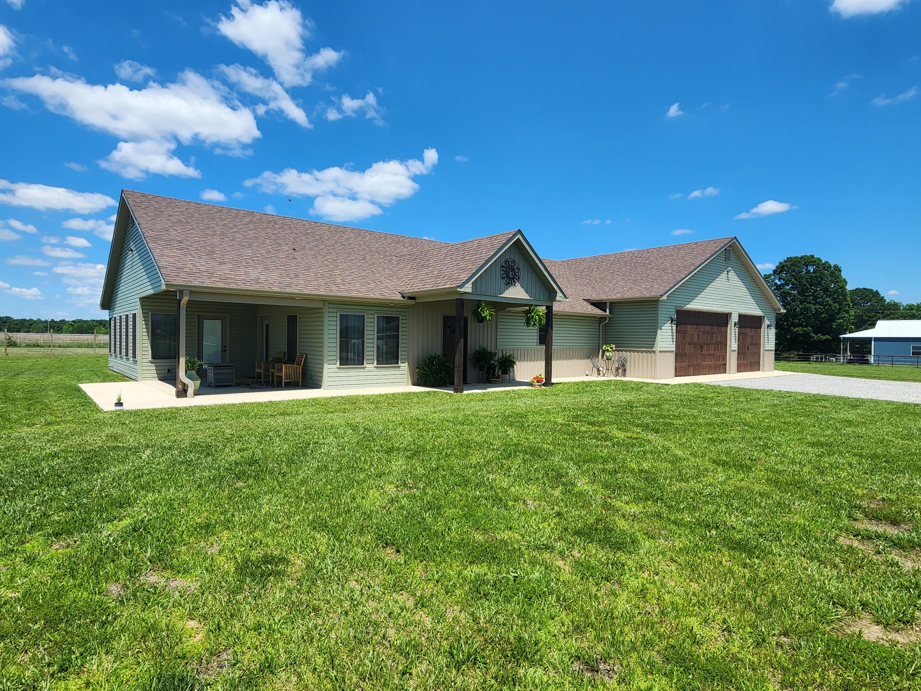 What a wonderful blend of space, location, and views! This charming custom-built 3 bedroom, 3 bath home completed in 2023 sits on 10 acres located in the heart of Golden Hills Equine Community. This home has an easy floor plan for everyday living while incorporating plenty of space for entertaining. Prepare meals with ease in the spacious kitchen, featuring granite countertops, farm house porcelain sink, pot filler, vegetable sink, breakfast bar, stainless appliances, walk-in pantry, stunning custom-built Beechwood cabinets. Vaulted ceilings adorn the great room and dining area. Relax and enjoy warmth and comfort from the adjoining sunroom with propane fireplace. Master bedroom built-in gun safe, walk-in closet. Master bath with walk-in tiled shower, double sink vanity. Enjoy the picturesque sunsets from the covered patio or stroll down to the stocked pond and catch a fish or two! Expansive 1800 sq. ft. garage/shop connects to home, two -9 x 16, one- 9 x 10  bay doors, separate heating & cooling heat pump, RV hook up and a full  bathroom. That's not all, pipe and cable fencing with an abundant amount of space to build a shop, barn, whatever your heart desires. Two bay loafing shed, dog run, miles of riding trails. Wildlife galore. Short drive to several river systems, trail rides, National Forest. Call to make this dream a reality.