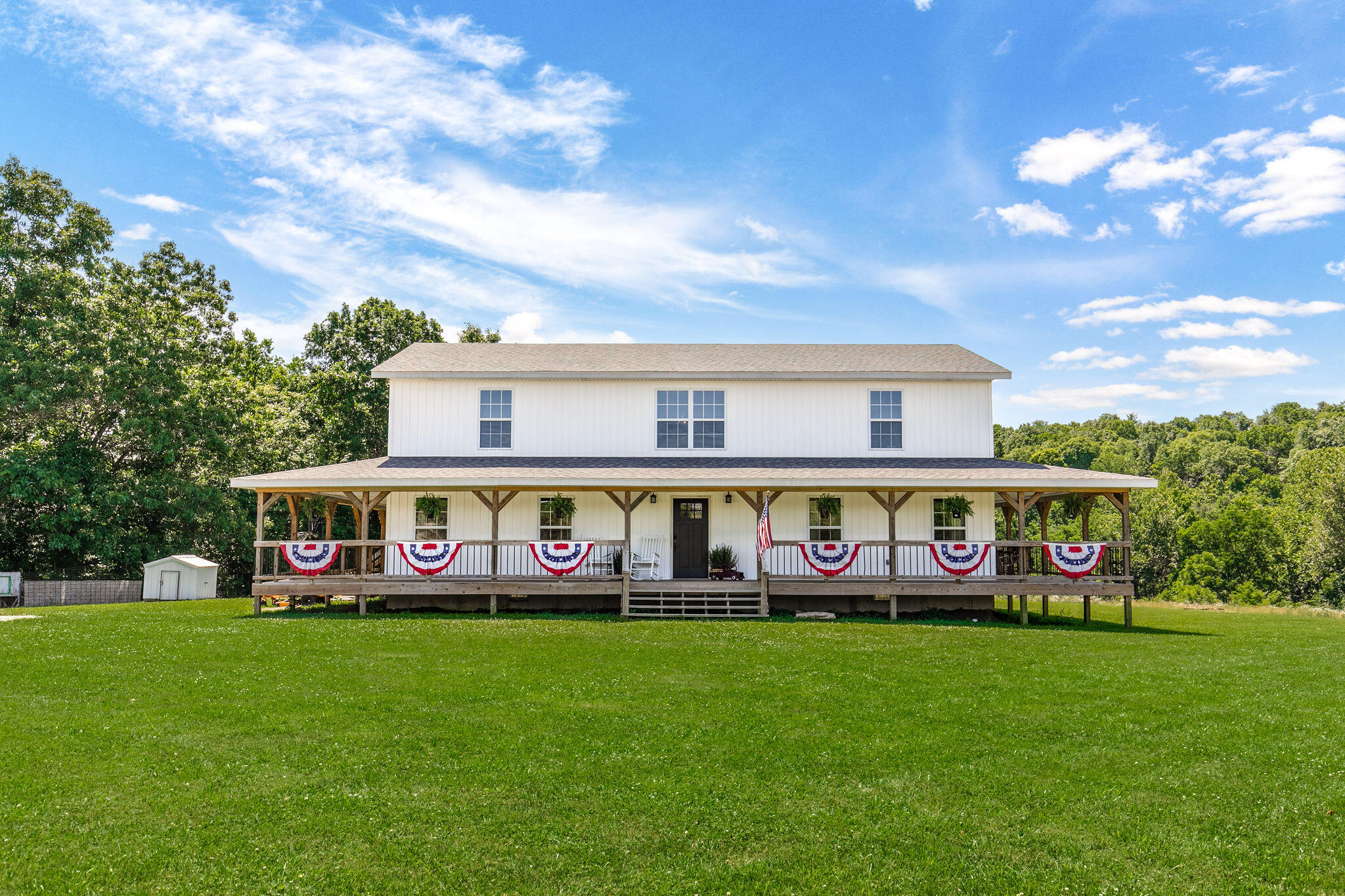STUNNING LIKE NEW FARM HOUSE ON 57 acres!! This home was built in 2019 and has been immaculately new since then!! Enter in the the vaulted entry way leading into the living area with tons of natural light and just the right amount of space for your guest and family. The kitchen has an abundance of cabinet and countertop space with tons of storage! Laundry room and guest bathroom are located just off the kitchen. Master suite on the main level with its own Walk-in closet, bathroom vanity, and shower. Climb the beautiful staircase to the upstairs where you will find five other bedrooms all with more than adequate space and their very own private bathrooms on the second level. Not only is this house a charmer it was built out of some of the best construction materials on the market. 2 x 6 walls, and spray foam insulation will have this house lasting you a lifetime! Sitting on 57 acres of gently rolling Webster County real estate makes this property highly sought after! This land will include just the right amount of woods to be covered in wildlife such as deer, turkey and many others! Tons and tons of pasture for your livestock and hayfields along With a 60 x 80 Haybarn. The wet wether creek runs approximately 3 to 4 months out of the year and serves as a good swimming hole and water source for the livestock. All of this is located less than a half a mile off blacktop highway just 3 miles south of Seymour. Beautiful sunrises and sunsets can be enjoyed from the complete wraparound porch. While location is keen, this place also has a very secluded setting with wonderful neighbors and large farms surrounding. Come and enjoy what the Ozarks has to offer!!!!