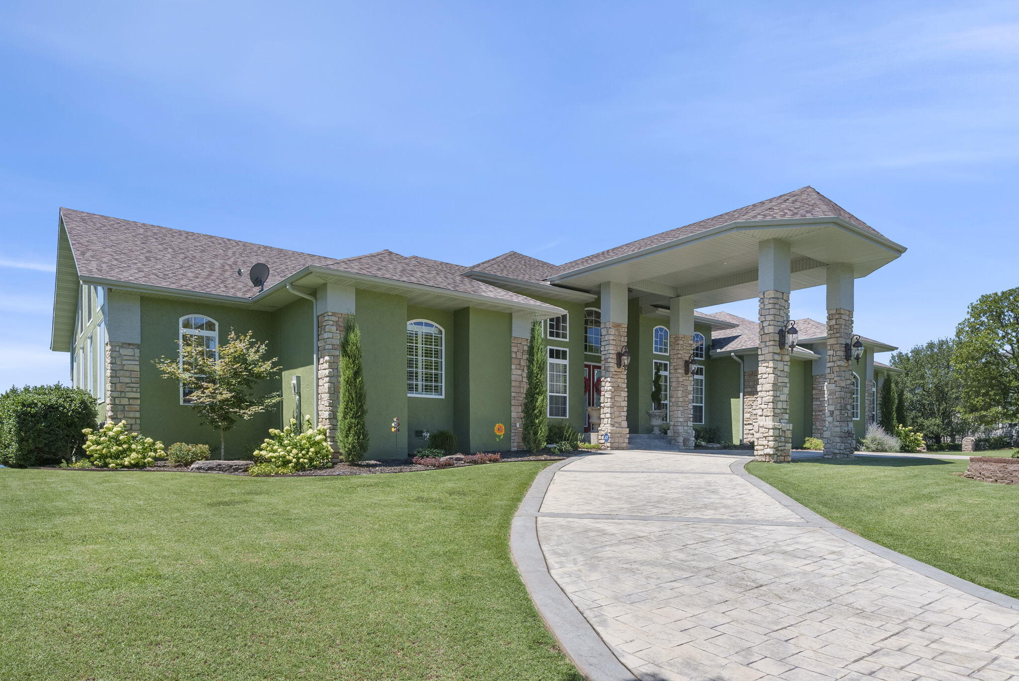 WOW!!! LOOK AT THIS AMAZING HOME!!!...SPECTACULAR Panoramic Table Rock Lake Views & IMPRESSIVE Custom Home that Abounds Quality & Impeccable Taste at Every Turn! You're Met with the Stately Circle Drive. Walk In the Door of This Luxurious Home and the Lake Literally Meets You...The Large Windows Bring In the Calming, Breathtaking Views of Table Rock Lake. The Chef in You Will Delight in the Well Appointed Kitchen w Center Island, Breakfast Bar, Granite, Stainless Appliances. Wake Up Every Day to the Views from the Master Ensuite w Cozy Fireplace & Deck Access....the Perfect Spot to Enjoy Your Morning Coffee While Enjoying the Lake Vistas....Luxurious Master Bath w Whirlpool Tub, Seperate Tiled Shower, Seperate Double Vanities & Closets. Main Level Spacious Covered Deck That Goes On & On Forever. Main Floor Laundry. Meander Down the Open Staircase to the Lower Level Where You'll Find Another Bedroom & Full Bath, Plus the Theatre Room, Rec Room w Pool Table that Stays & Well Appointed Wet Bar....Walk Out to the Large Patio & Gazebo Where There's an Amazing Lake View as Well. You'll Have Plenty of Room for All Your Lake Toys w the Spacious 3 Car Garage. Don't Wait to Call Gated Emerald Pointe, ''The Crown Jewell of Table Rock Lake'' Your Home. You'll Enjoy the Best Lake Life w Beautiful Lake Views, The Most Specatular Sunsets Imaginable, Marina that Offers High & Dry Storage w Courtesy Dock, Boat Ramp, Clubhouse, Pool, Tennis Courts.  Emerald Pointe has Quick Highway Access & is Conveniently Located to Dining, Shopping, Entertainment, Medical, etc. Branson Airport is a Short Drive, Along with Several of the Top Golf Courses in the USA - Top of the Rock, Buffalo Ridge, Payne's Valley. Big Cedar Lodge, Branson Landing, Silver Dollar City, and All the Entertainment & Shopping Branson has to Offer is Only Minutes Away! Hurry, You Won't Find Another Home Like This....It Is Truly the Ultimate Lake Home! Come see for Youself, You WILL BE BLOWN AWAY!