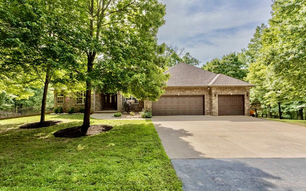 Are you looking for a home where you always feel like you are on a private retreat?  This is it!  4 wooded acres in Pebble Creek subdivision with a beautiful and well maintained all brick, walk-out basement home that incudes 5 bedrooms, 3 1/2 baths and a 3 car garage.  The main floor has a split bedroom plan with 3 large bedrooms and 2 more bedrooms in the basement.  the basement bedroom has a Murphy bed so it can serve as an office when the bed is not in use.  There is also a very large unfinished storage room that has a garage door to the back yard.  The in-ground pool is heated so you can continue to enjoy it well after the summer months.  The estate is gated with an electronic opener for your convenience.  there is even a creek at the back of the property at the bottom of the hill.  The seller are leaving the play set and house for the next owners to enjoy.  My favorite part is the large covered and enclosed deck that overlooks the wooded back and the in-ground pool.  There are many great entertaining spaces inside and out.  This home has been meticulously maintained and is ready for the new owner to call it home.