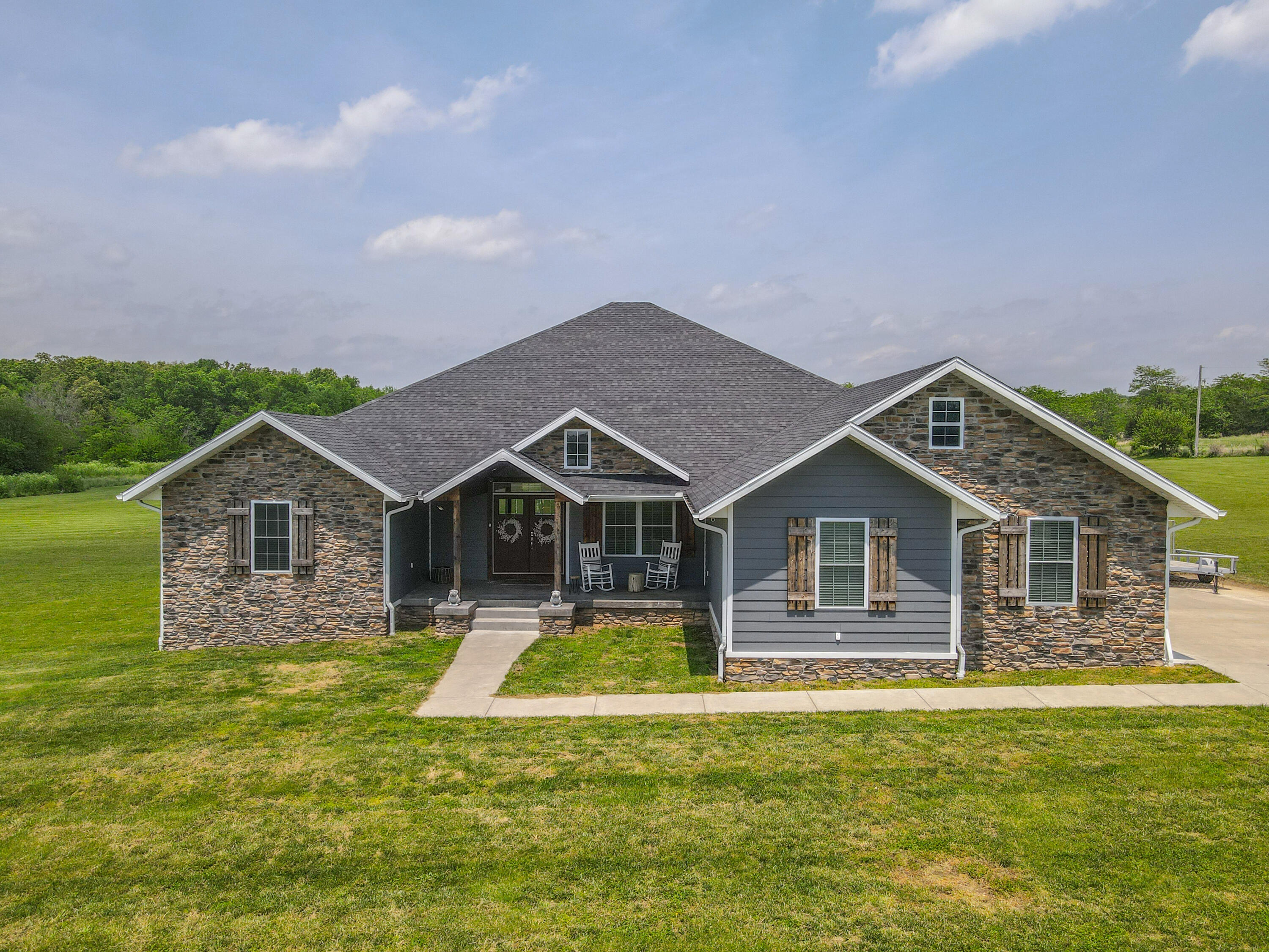 Welcome to the home of your dreams with 4 bedrooms, 2 and a half baths all on 8 beautiful acres! Step into this stunning home built in 2017 and fall in love with all the custom details! Come home after a long day and enjoy your luxury shower that is like a spa at home or enjoy a cup of coffee on your large back deck! The Master suit is your own private oasis complete with a huge walk in closet that has a island, a make-up station and double sinks! The kitchen has stunning granite countertops and a farmhouse sink! Cozy up by the fire in your living room complete with built ins! The open floor plan and beautiful style of this custom home will make you feel right at home! Call today for your showing of this outstanding home!!