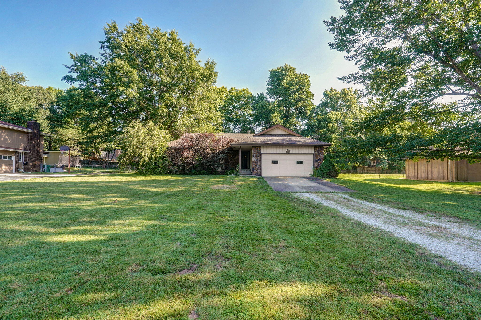 Almost 2500 square feet of living area with 4 bedrooms and 3 bathrooms.  2 living rooms and a sunroom.  Home needs some work and is being sold as is at this price.  Located in Hickory Hill CC subdivision just east of Hwy 65 and between Sam's and Costco.  Great location!  Garage has room for storage.  Lot is almost 1/2 acre and home sits back from road.