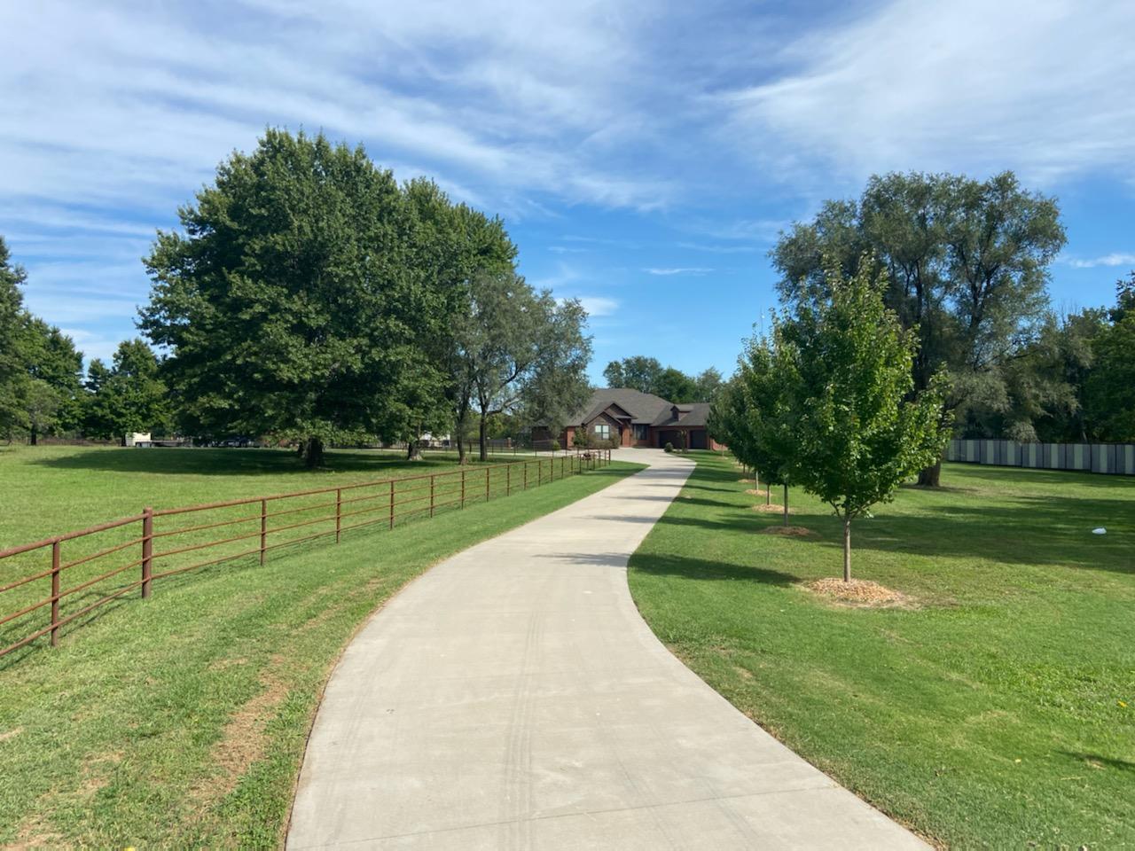 Amazing ONE level home located on 10 fabulous acres, just minutes from Springfield MO.  This exceptional custom built home features 4 bedrooms, 2 1/2 baths. Split floor plan that joins together an AMAZING Kitchen with Custom Knotty Pine Alder cabinets, Granite and fantastic under cabinet lighting Kitchen opens to large living area. 2nd  living area adjoins.   All with large windows bringing the outside, inside! Gorgeous outdoor night lighting. Nothing here is ordinary.  High efficiency HVAC, Tankless water heater and SO much more. That's just the beginning. You can bring all your toys up the picturesque 300 ft 6'' thick  Concrete Driveway. to  your, to die for, fully insulated and plumbed Shop.  Shop features it's own HVAC system and many extras.  Perfect for storing ALL of your toys!  Extra high doors for the  Motor Home, Cars, boats +. PLUS an Additional building for the messy equipment too!  Beautiful heated in ground pool! This fabulous 10 acre property is crossed fenced and would be perfect for Horses or Cows if desired, or just peaceful space for living.  Really a must see! Call for your private showing today!