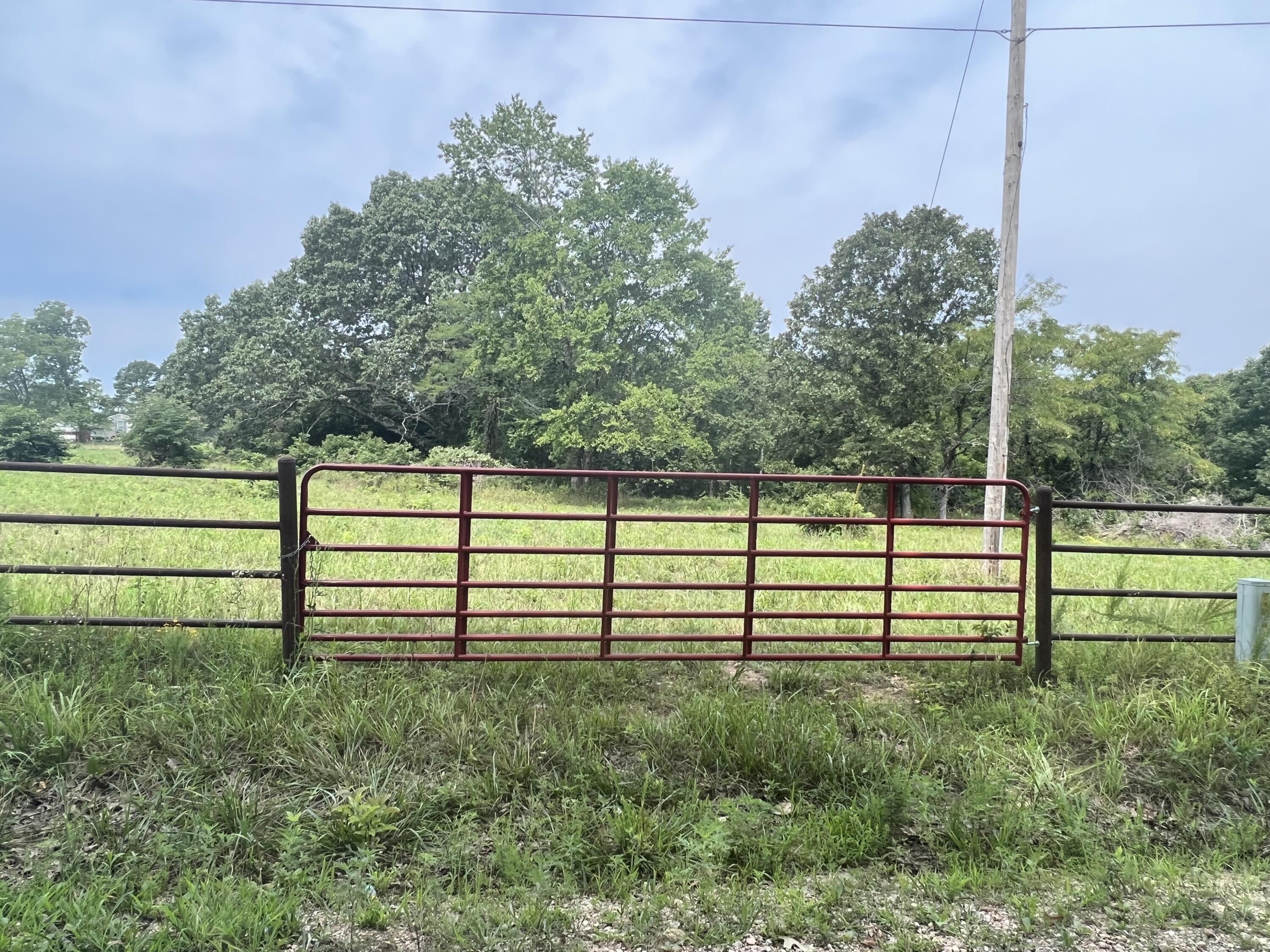 ACREAGE/HOMESITE Nice knoll homesite on this 4.55 acres with a long range view. Electric pole is on the property for immediate access to power. Acreage has a mixture of open and woods for pasture and wild life. It's surveyed and there is fencing that will need attention. There's a few walnut trees as will as a variety of other trees. Good road frontage on County and State roads, good corner location. Pull your camper or RV here and set up shop. Warmfork and Spring Rivers in the area for fishing & boating, Norfolk Lake 45 miles. National Forest & State Lands for hunting near. Reduced to $34,900
