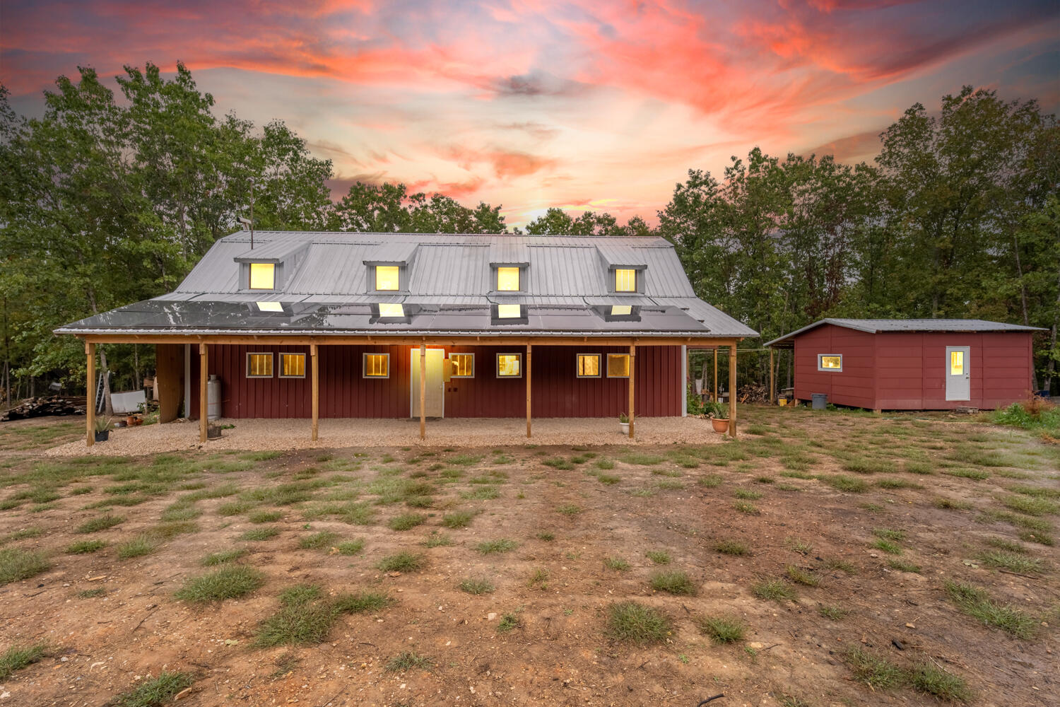 Great opportunity for anyone wanting to live closer to the land! This self-sustaining, off grid property has 3 homesites on 42 acres. Each home is equipped with solar panels for electric, and they share a community well to each location and gardens. First house has an open concept living on the main floor with two bedrooms and a large bathroom. The upstairs has 4 large bedrooms with plenty of windows for air circulation and solar panels on the roof to power the home. Improvements are still being made to finish out the home. Recent improvements include a finished bathroom and mini-split. You can sit out on the large front porch and over look the massive garden currently full of fruits and vegetables. Follow the road into the woods and you will come to another garden area, currently with tall corn stocks, and take a left. The 2nd cabin is unfinished studio style but has it own solar panels and kitchenette area. Outhouse across the drive. Continuing down the private road will dead end at an A frame cabin straight out of a fairytale. With its own large garden full of vegetables and lined with flower beds. This location also has a waterfall feature with its own creek. This one has one bedroom, a half bathroom and a kitchenette. Large windows, wood stove for heat and solar panels for electric. The rest of the land has mature timber and two ponds, great for hunting. Make this a quiet retreat or your new forever place.