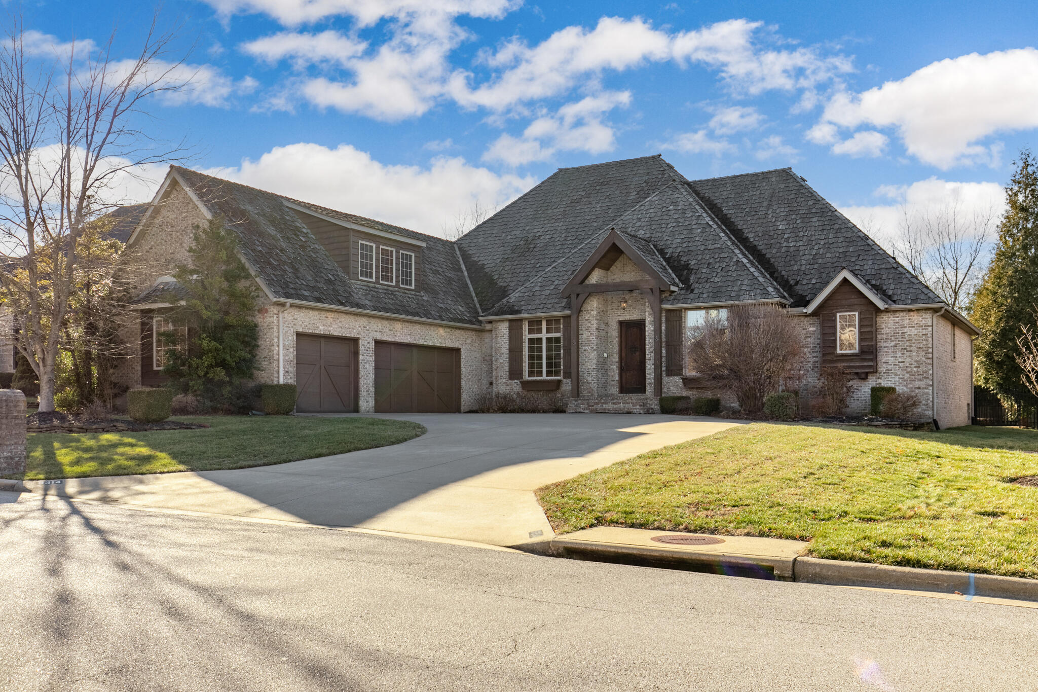 Stunning all-brick home in Fremont Hills offering 4 beds + office, 3.5 baths, screened patio, and pool! With a single level + upstairs bonus room layout, this beautiful home features high-end touches like hand-scraped engineered hardwood floors, architectural beams, solid wood cabinetry/trim/doors, built-in sideboard in dining room, plantation shutters, archways, and bullnose corners. Enter to the gorgeous foyer, formal dining to the left, and office (or 5th br) to the right. You'll love the high ceilings throughout. Multiple living areas include main living room, plus a spacious hearth room with gas fireplace and casual dining area. The thoughtfully designed kitchen and hearth room are the perfect spaces for gatherings! Kitchen features granite countertops, island, double ovens, separate gas cooktop, custom barware area, and counter seating. Sellers LOVE the hidden walk-thru pantry, perfectly designed to be accessed from the kitchen OR when bringing in groceries from the garage. Half bath in hall off kitchen. Huge primary suite is privately tucked away, and offers its own gas fireplace, large jetted tub, tiled walk-in shower, and walk-in closet with custom built-ins. Other 2 bedrooms on main level share a Jack-and-Jill bathroom. Huge bonus room upstairs has its own full bath, perfect for kids or guests. Finally, your own oasis awaits in the back yard! Covered screened porch walks out to extensive hardscaping surrounding a serene in-ground pool. This property backs up to a 3-acre parcel for a little breathing room. Both water heaters replaced Jan 2023. The Fremont Hills community is situated around a picturesque 18-hole, 80 acre golf course, and offers optional membership for golf, tennis, and resort-style pool. Go to fremonthills.gov for info on country club memberships, ordinances, utilities, taxes, and more. Easy access to Nixa, Ozark, Springfield, and Hwy 65. Nixa address, Ozark schools. Come see this one today
