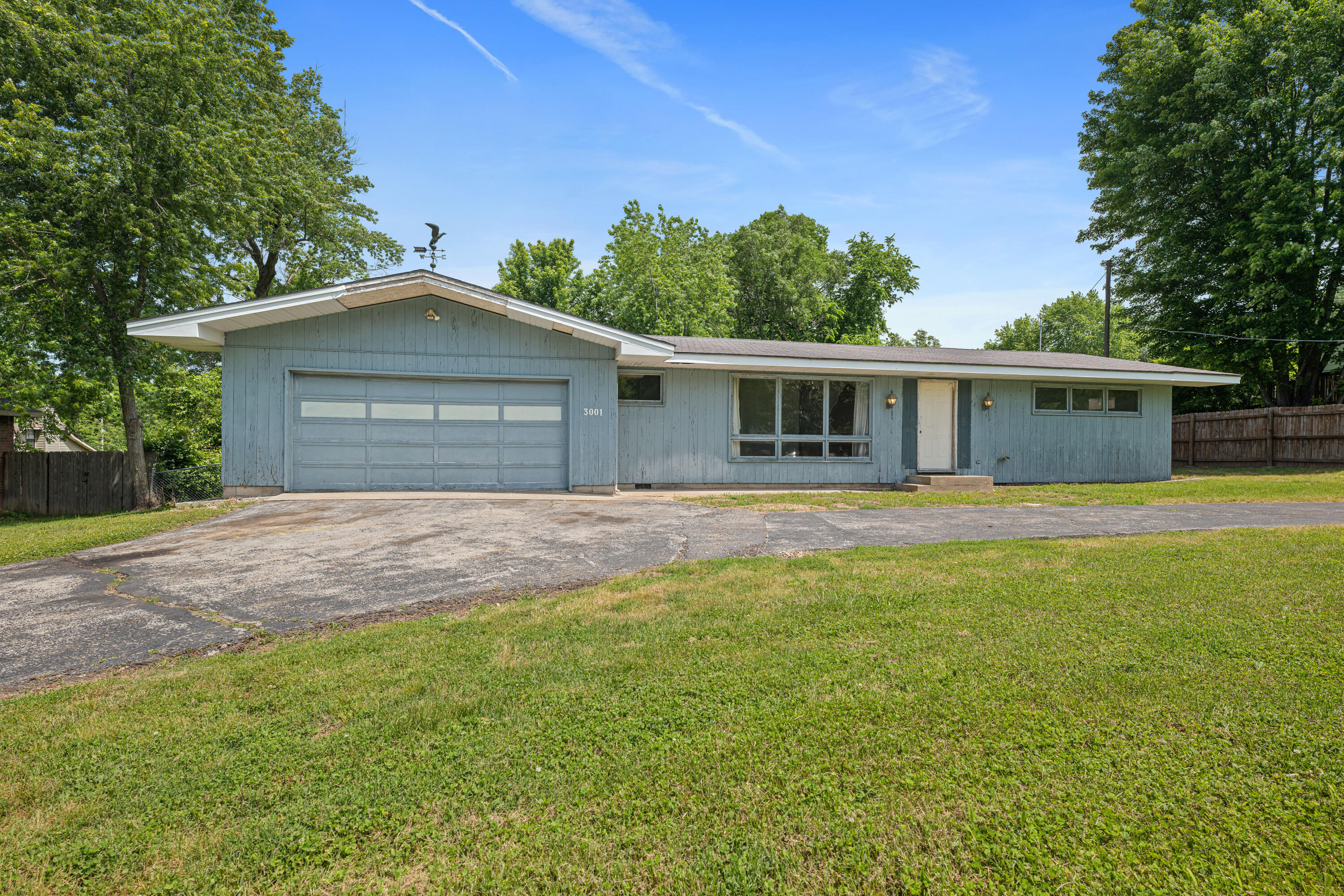 Looking for a mid-century meets modern blank canvas to make your dream home? Then you MUST see this amazing home located above Sequiota park! This home is as original as you can get! The exterior is pecky cypress paneling and has modern double-pane tilt and turn windows. The circular drive and huge front yard are a great added bonus to this home. The interior is flooded by natural light from the enormous picture windows in the front living room. The kitchen features original custom cabinets with hidden copper hinges and copper pulls. The dinning area even has a pass-through for a landline to the main bedroom. The hallway is decorated with original grass wallpaper and mini wood-accented chandeliers. The two oversized bedrooms have an abundance of windows and no shortage of closet space. The main bathroom is the only space that has been remodeled. The laundry room has a fabulous pocket door and even a sink hookup. As you walk back through the living room you will notice all the unique features; push button light switches, pocket doors, and clean 90* drywall edges instead of door and window trim. Before entering the garage, you will see a kitchen pantry and half-bath that has totally groovy wallpaper. The washbasin and commode have been removed, which makes room for your personal design. The spacious garage comes with cabinet space, built in shelves and pegboards.Upon walking through the kitchen to the back door, you will find a concrete patio with a sprawling backyard. The backyard has a chain-linked fence and is waiting for you to turn it into your personal backyard oasis. This 1960s, one-of-a-kind home is ready for you to re-envision it to its full potential! The home is also blocks away from Sequiota Elementary school!