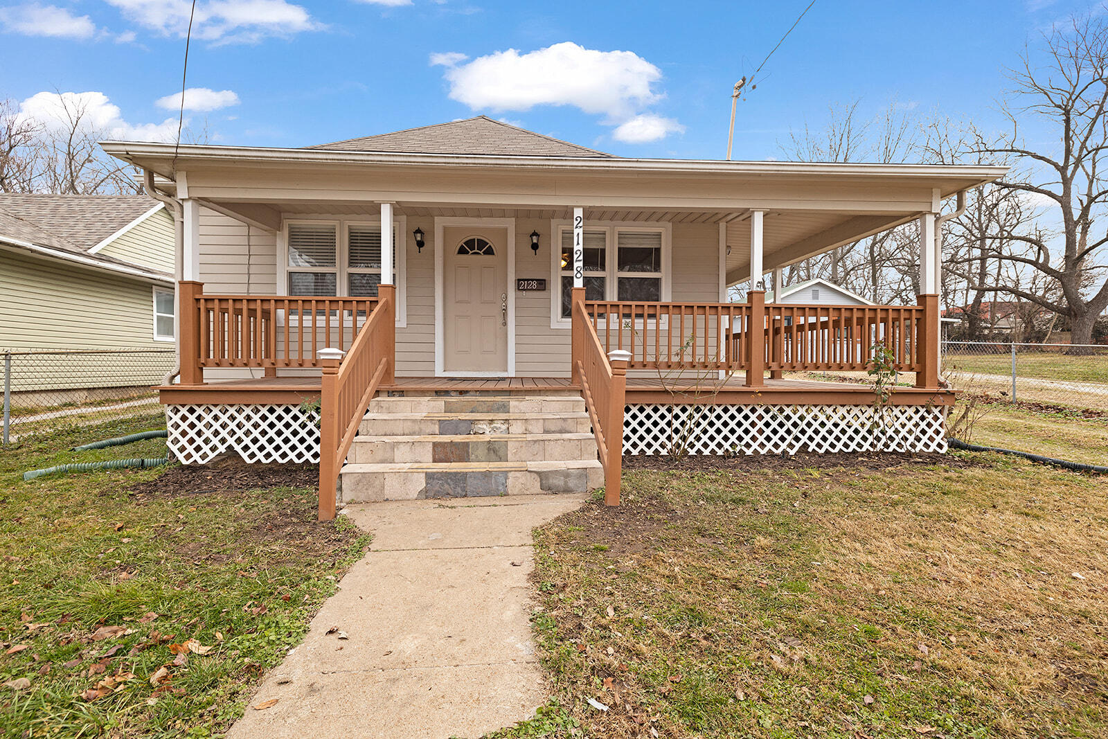 Step into this delightful bungalow, a blend of 1916 charm and modern updates. With a wraparound porch and a fenced yard, this home exudes warmth. Inside, enjoy immaculate molding, updated floors, and fresh paint. The large kitchen seamlessly combines vintage aesthetics with functionality.Stay comfortable with newer central A/C and heat, and benefit from 2020 upgrades like electrical, siding, and insulation for efficiency.  The 2-bedroom, 1-bathroom layout offers a split floorplan and flows well. This MOVE-IN READY home invites you to experience classic charm with a touch of simplicity.The primary bedroom offers a walk-in closet, and laundry room is large and even offers a small pet door! This well maintained gem should qualify for FHA, VA and MHDC loans if so desired. We don't expect this beauty to last long, so schedule your showing today!