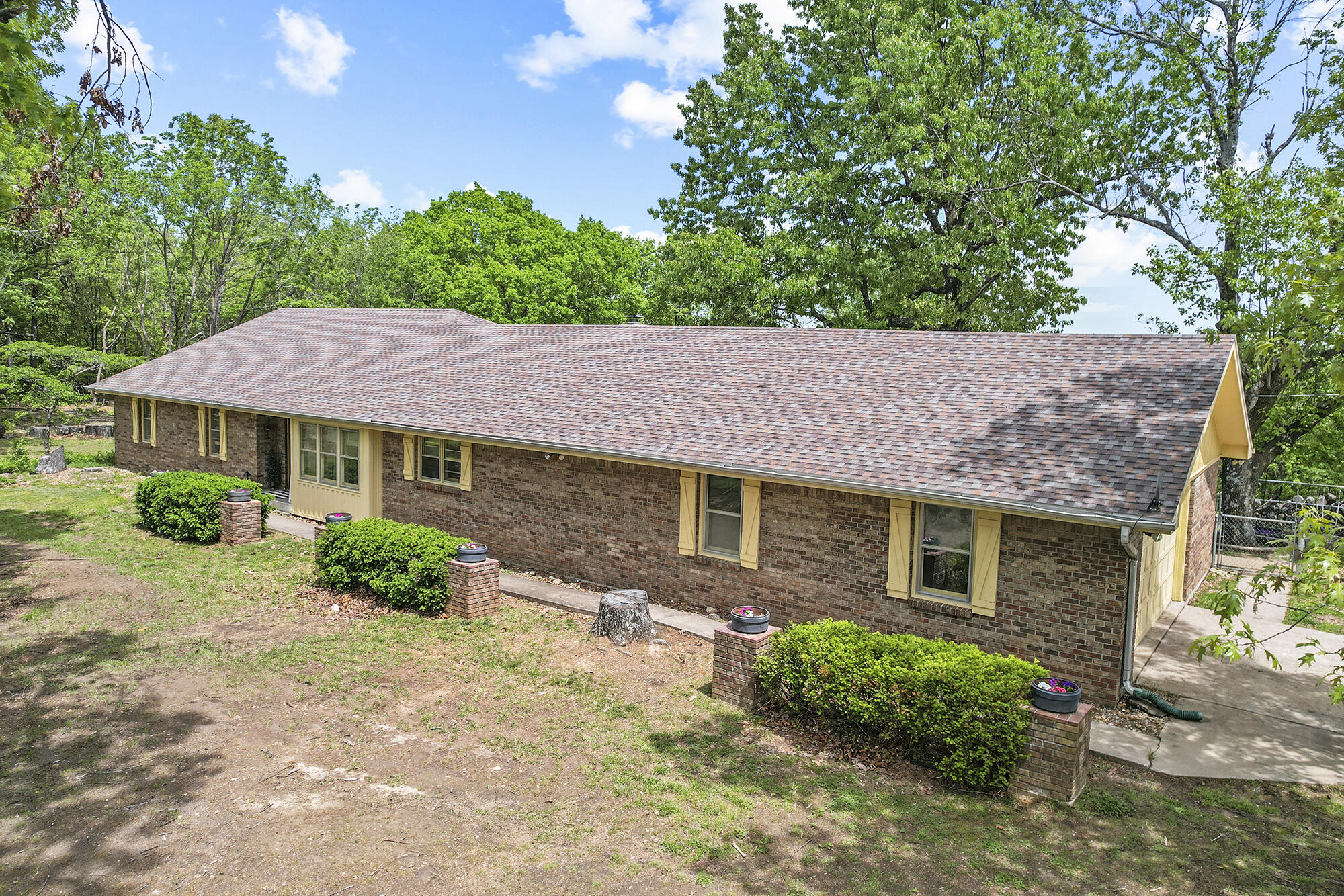 Located on nearly 10-acres, this cozy 4 bedroom, 2.5 bathroom home offers an escape in a beautiful setting. As you step inside, you'll be greeted by newly updated interiors, featuring fresh paint and stylish flooring throughout the kitchen, blending current styles with the past in this spacious home.Outside, the acreage is equally impressive with cherry trees that not only enhance the beauty of the property but also attract deer, adding to the idyllic charm of your backyard view. Imagine starting your mornings with coffee on the back deck!Significant improvements have been made to ensure the safety and enjoyment of this property, including the removal of large, potentially hazardous trees. The former deck area around the pool has been transformed into a cozy fire-pit area, perfect for intimate gatherings and starlit evenings.This property offers not just a home, but a retreat from the hustle and bustle of everyday life, all while providing the comfort and luxury of modern living. Experience the perfect blend of nature and elegance in a home that has been carefully updated and lovingly maintained. Your forever home awaits! To top it off, ask your agent about the potential to assume the loan on this property!
