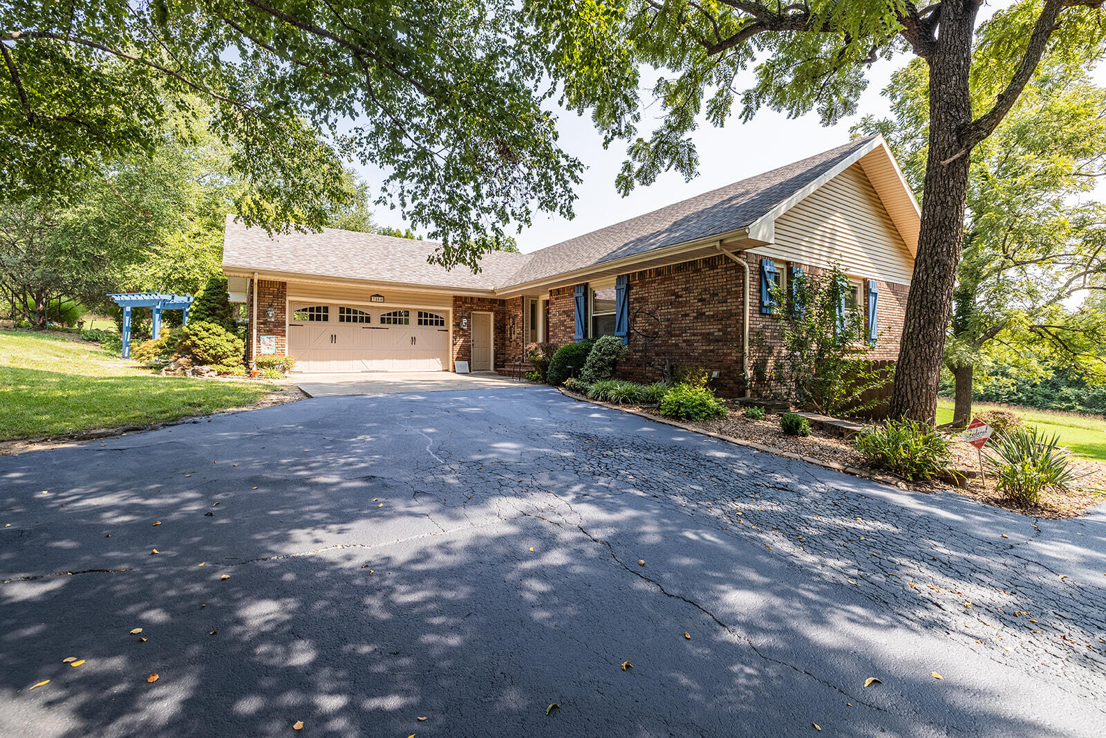 OPEN SUNDAY SEPT 24, 2-4PM! Looking for peace and quiet? Look no further! Welcome to this wonderful Willard home on 10 acres! BRAND NEW roof! As you turn on to the farm road you will feel the tranquility. As you enter you will feel the natural light beam through the living room. Open concept living and dining area with wonderful brick fireplace with blowers. The kitchen features island with new electric range, wrap around counters with view to the wonderful back yard. HUGE covered and screened back porch, TRANQUIL back yard with large water garden with irrigation, pergola, paver patio and much more. Main bedroom also on first level with ensuite bath. Additional front bedroom on main level currently being used as an office. Half bath off of the kitchen with pantry and access to 2 car garage. Downstairs you will find brand new carpet, large second living space with another fireplace and french doors out to rear patio and wet bar. 2 additional bedrooms downstairs, one also with access to rear with french doors. Full bath, utility room, and laundry space. Newer HVAC system, water softener, and home water filtration. This home features 2x6 exterior walls, newer windows, oversized storage areas. This home has been wonderfully maintained over the years and is ready for its new owners, do not miss this opportunity!