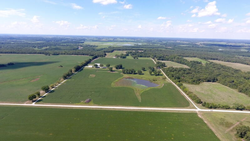 Country Home, Horse Stables, Lake, Tillable Acres - For sale is a premium farm showplace located in western St Clair County, Missouri, just south of the Osage River.  This 68-acre property boasts over 50 acres of tillable ground (currently in wheat), a 3-bed/2-bath home, 3 outbuildings, mature oak trees, & a lake located within view of the home.  It's the total package in a great location, with million-dollar views at just over half the price.  The 1,760 sq ft home features an updated interior, wrap-around deck overlooking the acreage, and gazebo. New plank flooring, new fixtures, open living space, stainless appliances, & plantation blinds are just a few of the highlights in this beautiful, manufactured home. The home sits down a 1/4 mile driveway with a view of the entire drive from the home. Affectionately called the 'Stables Farm,' the property features impressive outbuilding improvements perfectly designed for a horse farm.  The 4-stable barn is 44'x90', has 50 amp RV hook-ups, & room for many more built-in stables. The 40'x60' barn has a tack room & plenty of space for hay or animal storage. In addition to their size, these buildings give the property a curb appeal that is rivaled by very few farms. Other than the larger 2 buildings, a 2-car garage (25'x32') sits just west of the home on the circle drive. If recreational opportunities are high on your list, then this property offers well.  The stocked pond boasts a nice fish population & is loaded with ducks and geese in the winter.  This farm is located close to the Linscomb Conservation Area that allows deer, turkey, upland game, and waterfowl hunting.  Just up Hwy 82 is access to the Osage River and Truman Lake, which boasts thousands of acres of hunting, fishing, & hiking opportunities.  So, if you are a farmer, outdoorsman, horse-lover, or just want to get your own piece of country-fresh air, this property needs to make your short list. Thanks for looking, and we hope to see you in the country one day.