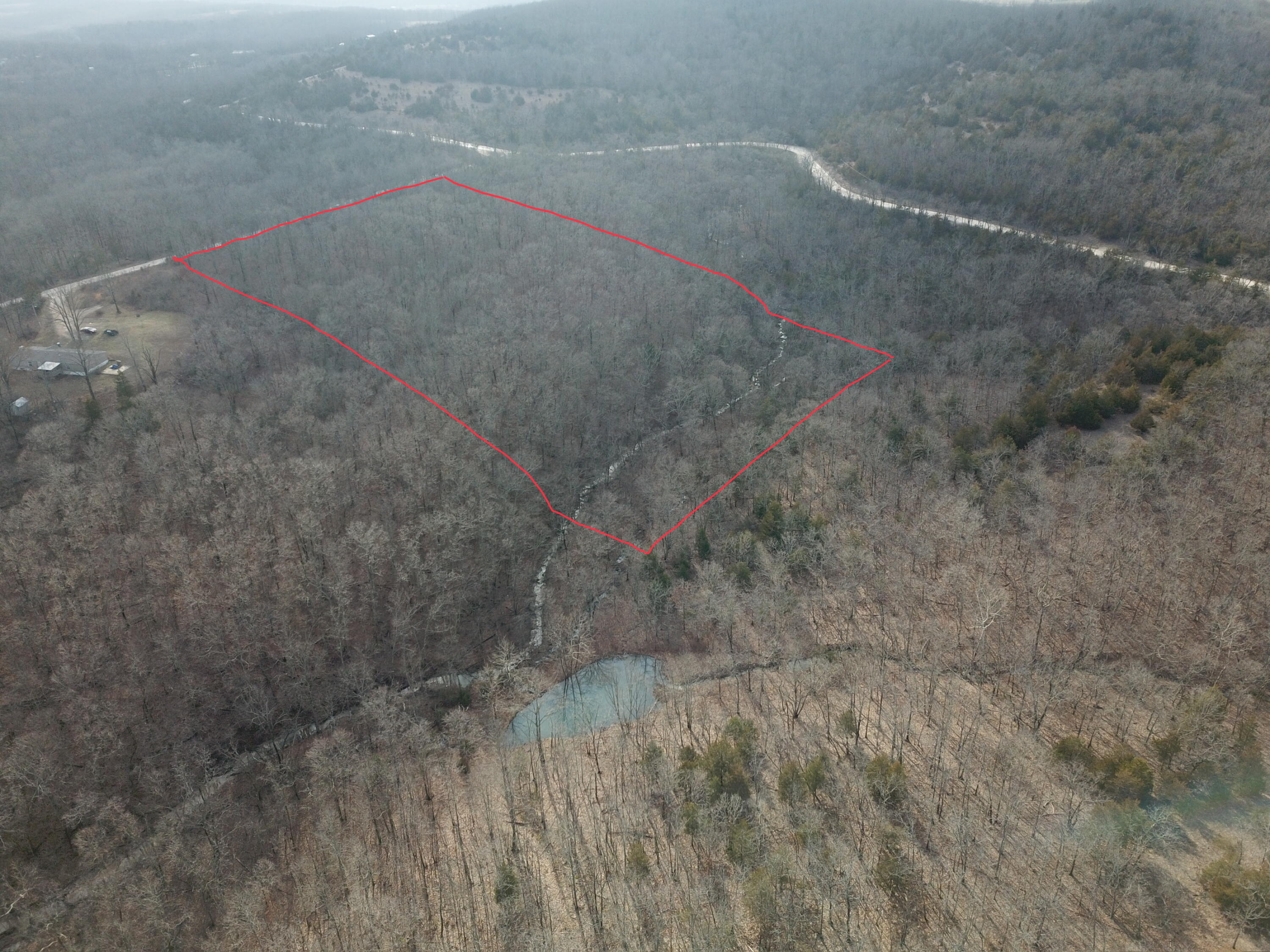 Check out this beautiful 7.28 acres of land located in Texas County. Tucked away just outside the city limits of Mountain Grove, this land is perfect for your next home! The land is currently mostly wooded and the majority of it is flat enough to build a single level home or build a walk out basement home or even put your double-wide mobile home on it. The back side of the land has an active creek which is gorgeous to view. The wildlife in the area are amazing to watch come through the land and creek. This beautiful piece of property won't last long!