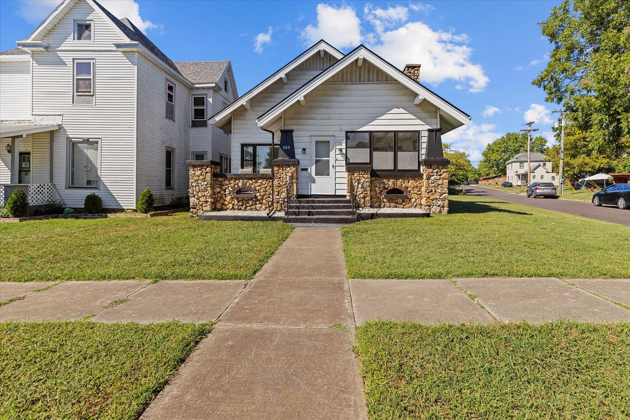 Come fall in love with this charming bungalow-style home in the heart of Monett. This adorable home offers 3 great sized bedrooms with 2 newly renovated full bathrooms and BRAND NEW ROOF installed 9/12/22! Don't miss the upstairs fully floored attic, a blank canvas for all of your ideas and storage needs! As you enter the home through the cozy enclosed porch you will fall in love with the beautiful high beamed ceiling, small bar area, huge living room with wood burning fireplace, you will really appreciate the efficient layout inside and out. Don't look too quickly and miss the built-in cabinets galore! Kitchen/Dining combo AND a formal dining, ready for all your guests! Pantry is tucked away out of sight ready to store all your items. Laundry room just off the kitchen towards the back door also out of sight. Last bedroom has a walk-in closet great for more storage. If this still isn't enough storage space, please check out the 16x24 detached garage with a carport AND the partial basement! NEW Flooring, Neutral fresh paint throughout, and ALL APPLIANCES STAY! Gas Cooktop, Refrigerator, Washer/Dryer, Wall Ovens, and recently installed electric water heater. Backyard patio also perfect for endless sunset views and BBQ's. HOME IS JUST READY FOR YOU TO MOVE IN!