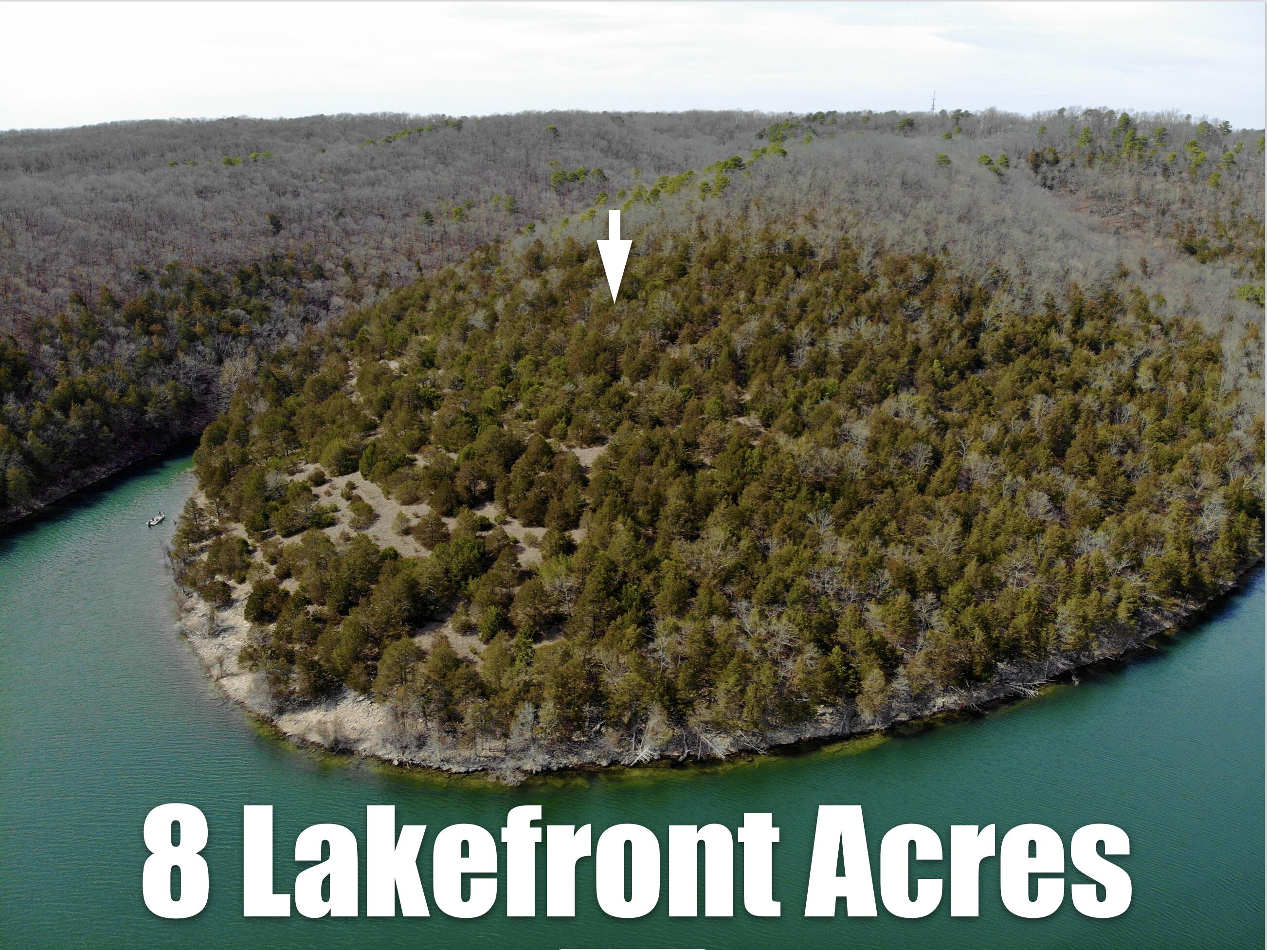 8.2 lakefront acres with phenomenal unobstructed views! Look across the big water view and you'll see national forest land on the opposite shore, ensuring that you'll see undisturbed natural beauty for many years to come. Located away from it all and completely private, yet only 5 minutes from Harter House in Kimberling City. The entrance gate opens to a quaint lane leading you through the national forest and to your secluded acreage. The path to your home site leads you past a wet weather creek and beautiful rock outcroppings. Electricity is at the road. No restrictions on this lot, so you can dream big! (Owner Agent)