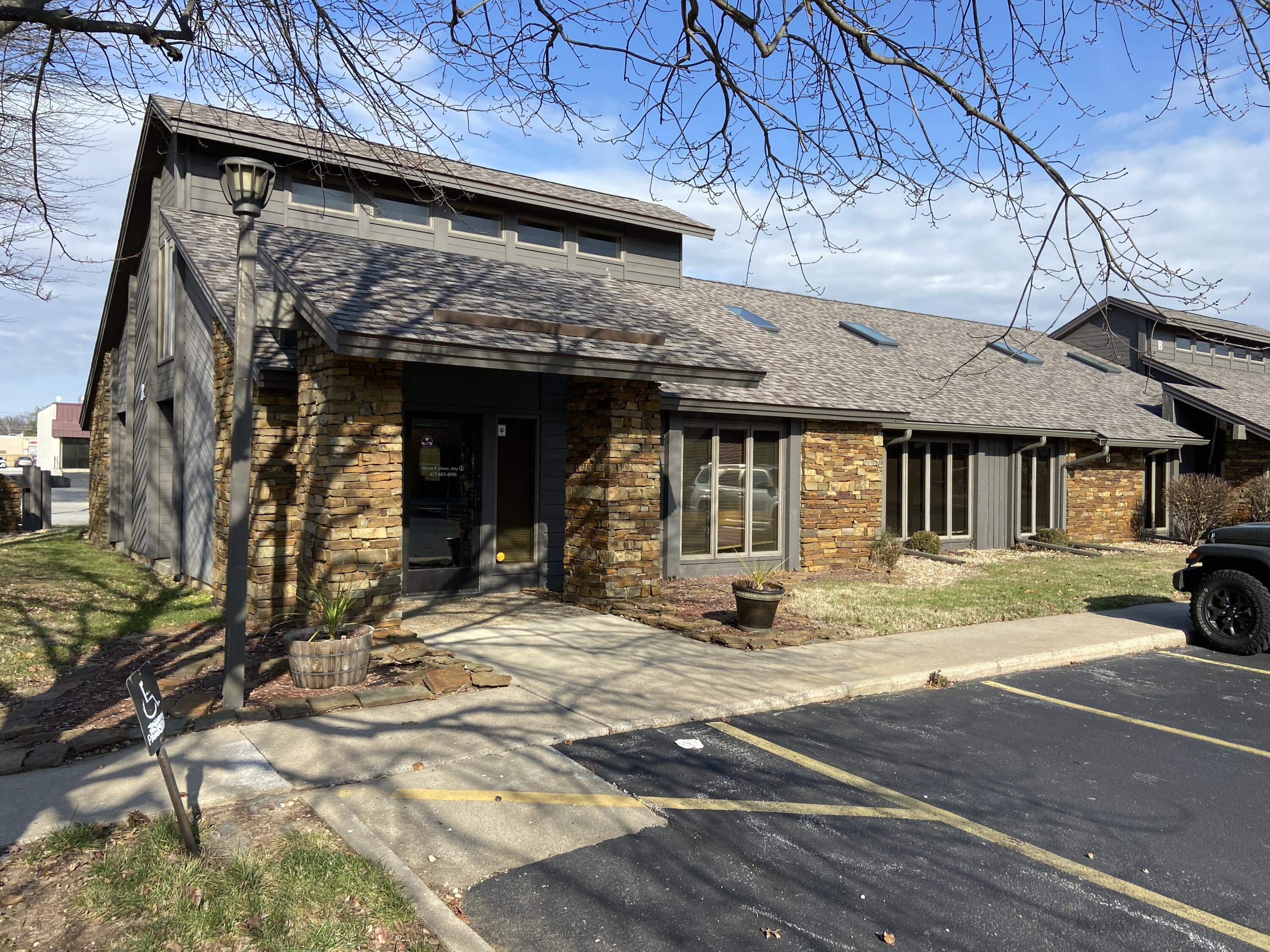 Outstanding professional office. Great infill details with custom woodwork, built in desks, and bookshelves. The indirect tray light highlights the interior throughout the unit. This approx. 1,232 sf space has light oak hardwood floors in all offices and hallways. Reception/waiting area, front office staff area, 2 large offices, restroom; modified gross lease rate of $1,750 mth/ includes gas, water, sewer, electric & CAM. Tenant pays internet, telephone, janitorial, qrtly insect treatment and liability insurance. This lease space offering is for the main level only. Upstairs mezzanine office is occupied and will remain should the main level be leased. Need 24 hr notice. Thank you.