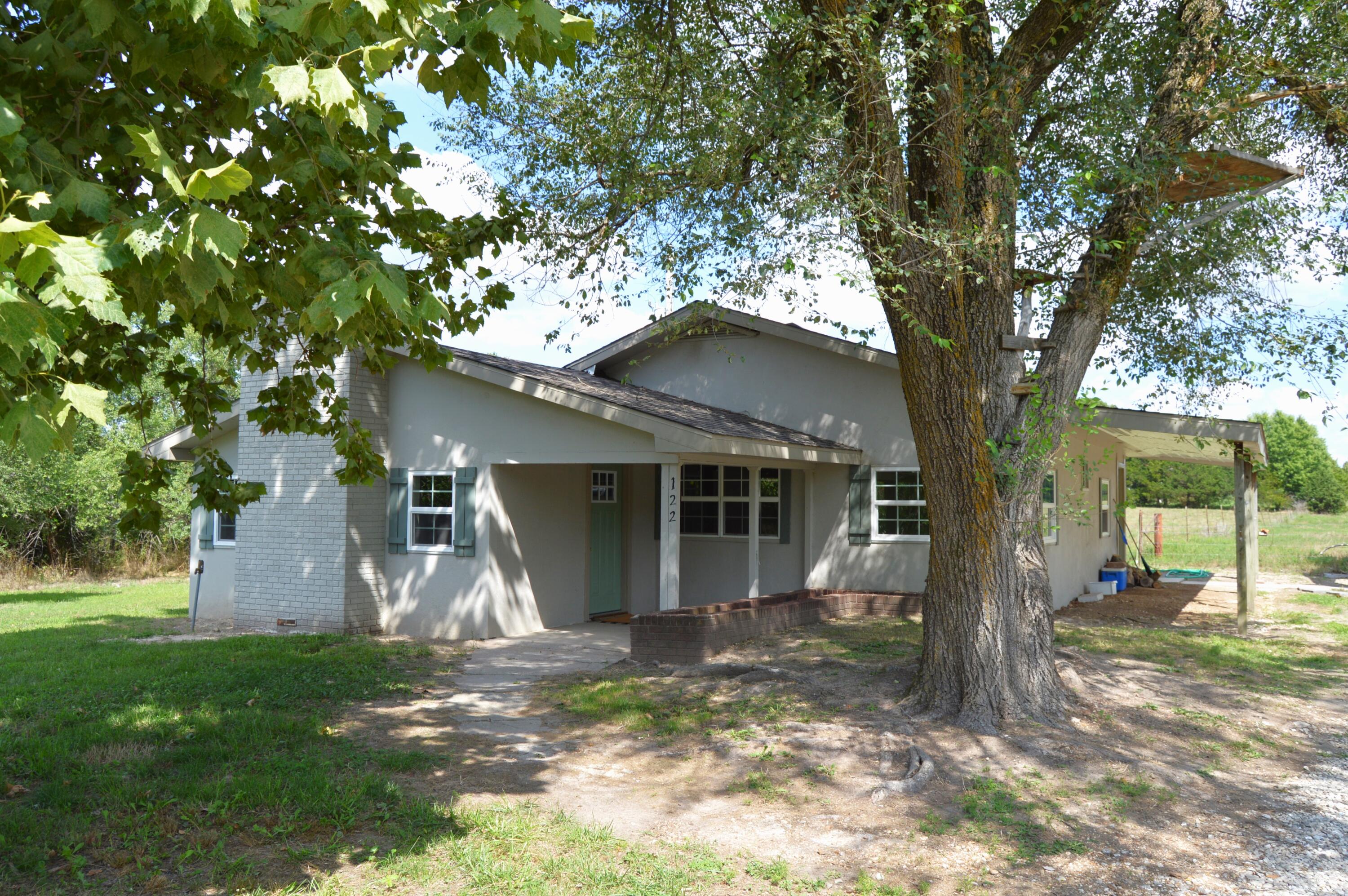 This charming 2bd 2ba has just been extensively remodeled, including all new roof, flooring, kitchen cabinetry and appliances, insulation, and wall finishes. Featuring a split-bedroom floor plan, it offers privacy and convenience. The primary bedroom and bathroom include a large closet space. The secondary bedroom and bathroom are easily accessed through the large dine-in kitchen or through the laundry/mudroom area at the back door. The large dine-in kitchen includes a large bar and all new cabinetry and countertops. The woodburning fireplace in the living room makes a cozy focal point and provides additional heat. A new well pump was installed in 2018. Sitting on just under two acres in Marshfield school district, you'll want to see this property!