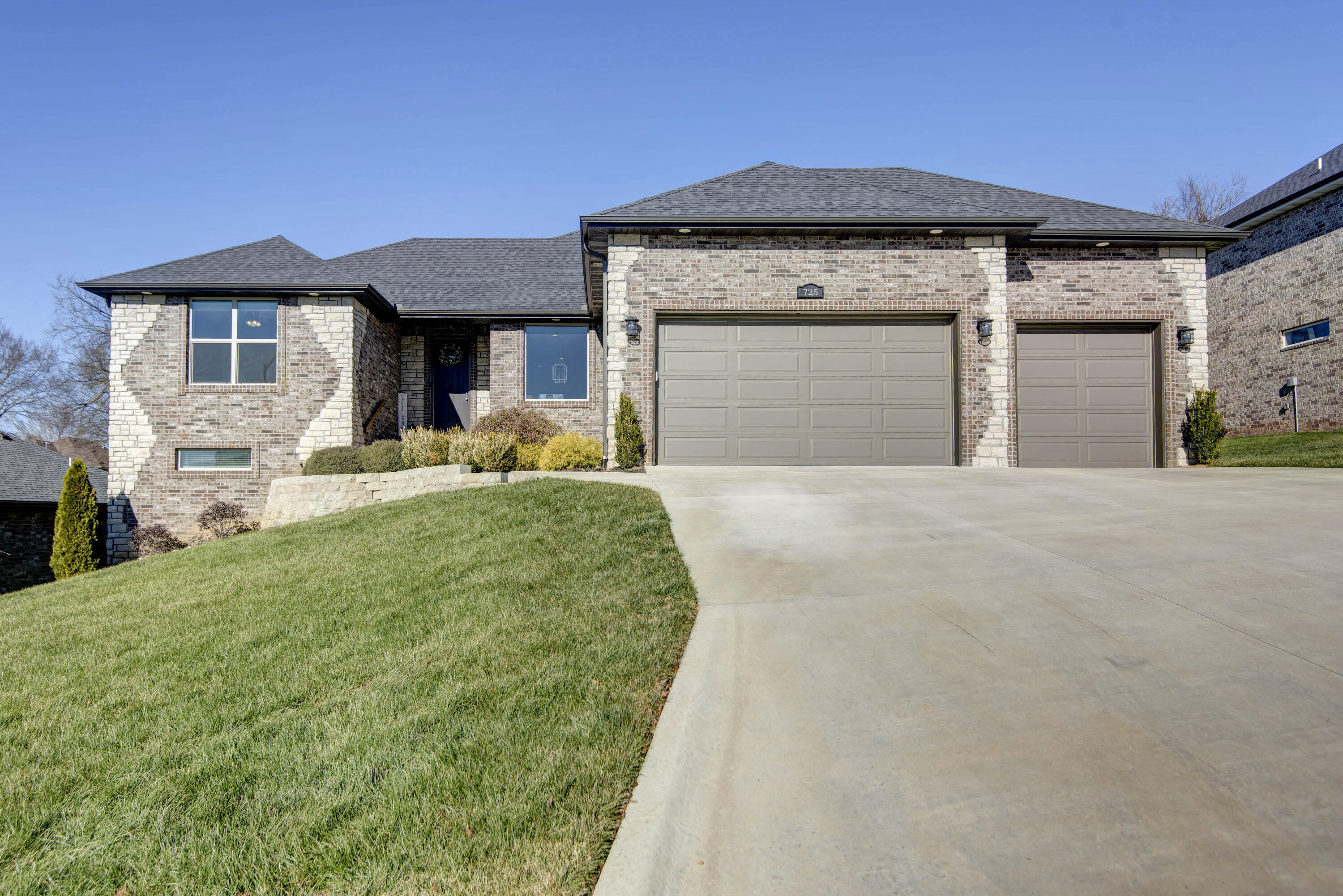 The location, open floor plan and like-new condition are just a few of the reasons you will love this exceptional home! This five-bedroom, three full bath, walk-out basement home is located in Nixa's Spring Manor Subdivision. It is only minutes from schools, park & aquatic center! Once inside, you will discover a stunning open kitchen with custom cabinets, gas range & granite countertops. Just off the kitchen is the large primary bedroom and ensuite with a double head tile shower. The second bath features a dual vanity and granite counters. The basement includes two more bedrooms, another bathroom, a wet bar, entertainment space and ample storage! A storm room is a bonus in this basement! Gorgeous built-in electric fireplaces are located upstairs and downstairs for a modern & warm feeling. The covered deck & covered patio make ideal outdoor living areas, where you can sit and overlook the large backyard. Do not miss this well cared for home...schedule your private showing today!