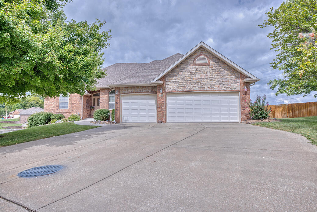 Beautiful, move in ready walkout basement home located in Ozark Heights Community at end of cul-de-sac.  A premier community located convenient to Hwy 65/CC that includes swimming pool, tennis courts & walking trails.  Home includes lots of extras, including a covered deck with mount for TV and plenty of room for table or lounge chairs to enjoy the private area (no building to be done across street) and a beautiful Koi Pond.  Formal living space and dining room upstairs.  Wet bar and bedrooms in basement perfect for mother-in-law quarters, college student or large family.  Call for private showing today!