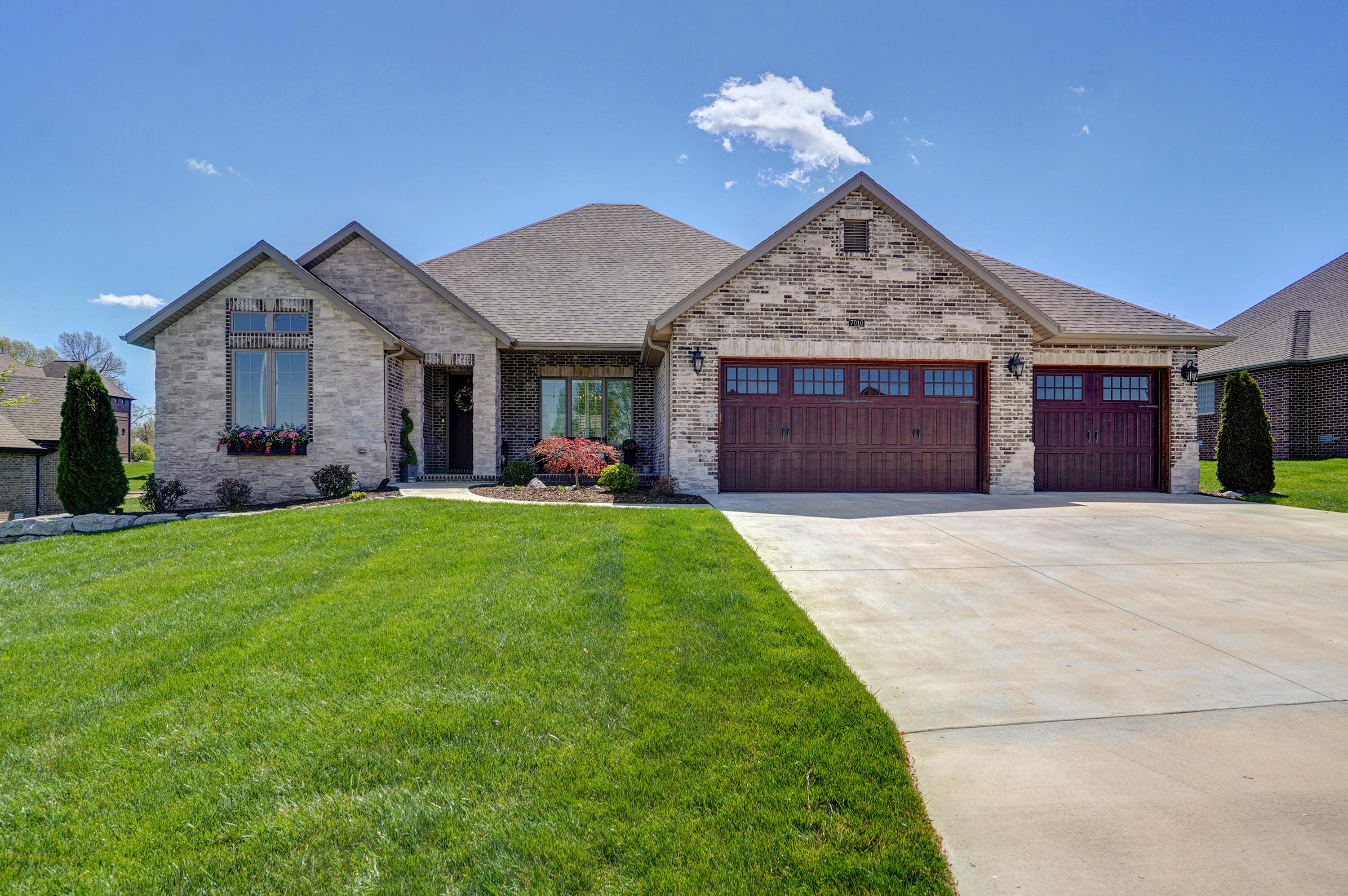 OPEN HOUSE SATURDAY & SUNDAY 4/22 & 4/23 1:00PM-4:00PMWelcome to your dream home in the highly desirable golf-community of Fremont Hills! This stunning custom-built home is the epitome of luxury with over 3000 square feet of spacious living all on one level. From the moment you step inside the grand entry, you'll be greeted by the large living area and the kitchen of your dreams, featuring high-end finishes throughout!This home boasts four spacious bedrooms and three beautifully appointed bathrooms with distinctive tile work, including mosaic in the master bath. The kitchen features custom cabinetry, premier appliances, including a counter-depth commercial refrigerator, induction range, double convection ovens, KitchenAid microwave and dishwasher, plus instant hot water, making it a chef's dream! There are considerable electronic enhancements throughout the property for all of your charging and lighting needs. Don't miss the extensive upgraded accessibility and lighting fixtures throughout the property!You'll love the solid hickory wood floors, top-grade carpet, and plantation shutters throughout the home. The professionally landscaped yard with built-in uplighting, sprinklers, and an incredible back patio with a custom brick/stone outdoor fireplace, including a specialized TV insert, is perfect for entertaining guests on game day or relaxing on a beautiful afternoon.The exterior of the home features upgraded brick & stone with a German schmear finish, along with an expanded patio area, making it one of the most well-cared for, clean, and impressive properties you'll find in today's competitive market.Don't miss your chance to see this beautiful property in person. Schedule a showing today, and start living the life you've always dreamed of!