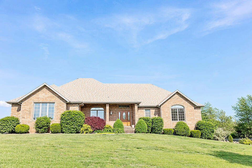 This beautiful all brick walk-out basement home sits on 10.56 A M/L. The property has a huge brick shop that is heated and cooled, trailer barn, and horse barn with stalls. Riding arena and 2 paddocks to let your horses graze.The home has a large kitchen dining area that will be great for entertaining! Not only does this home offer ample cabinetry and  upgraded appliances that are sure to impress but also eat-in kitchen dining, bar seating, a cozy hearth area complete with a fireplace and an additional ice maker! Formal dining room, 3 bedrooms, living room are on the main floor. The basement has a kitchenette, family rooms, and one bedroom. The home has a generator for the house. The roof is only 3 years old, hot water heaters, (one is in the shop) are less than a year old. HVAC is 6 years old.The large workshop has a 3 car garage and shop area that is heated and cooled, full bathroom, additional septic, and an upstairs for storage. The storage area is large enough you could finishing out for living quarters.The horse barn has a tack room and 6-12 x 12 stalls. Running water is in each stall, heated tack room. This property is a total of 2 parcels 6158 and 6136 Farm Road 57.