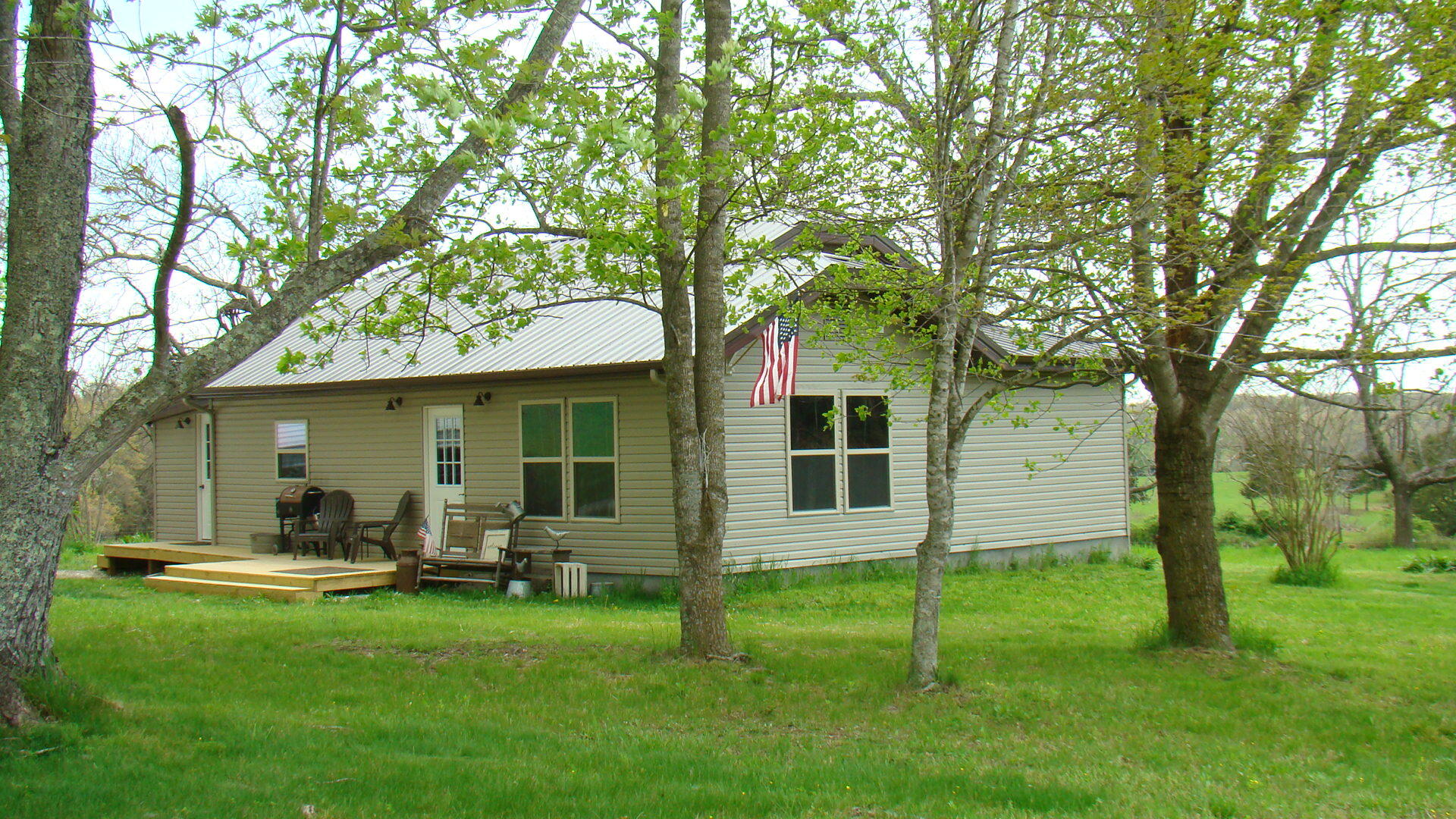 Check out this completely remodeled home with paved road frontage approximately a mile from city limits and situated on 3 surveyed acres! This 2 Bedroom 2 bath home offers New Cabinets, Island/Bar w/ cabinet storage underneath both have Butcher Block Countertops. New underground electric service, breaker box, wiring, all new fixtures, Northern Zone Windows, water lines, vanities, tub & walk in shower units, even the kitchen sink! Propane Cookstove, Dishwasher and built-in microwave/filter included. Central heat and air. Hardwood flooring in all rooms except both bathrooms have tile flooring .16x27 storage shed. Drilled well. Land is gently rolling