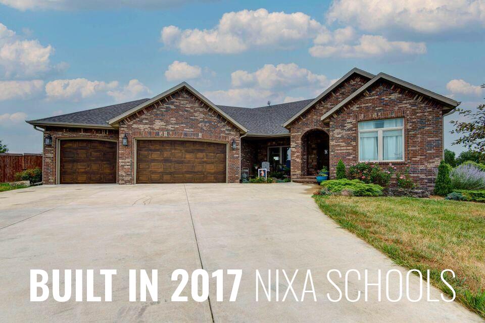All brick walkout on 5 acres, Ozark address with Nixa Schools! This 2017 build has much to offer, with open floorplan, beautiful hardwood flooring throughout, granite countertops, Kitchen aid gas cooktop, double convection ovens. Soaring 10 ft ceilings, vaulted ceilings, split bedroom floorplan, spacious master suite, high end security system, private well, fenced yard, firepit, huge covered deck. Basement features: hardwood flooring with carpet in bedrooms, unfinished space for storage or future media room, rec room, or hobby room. (note framed doorway for added access into main living room) concrete storm shelter. Quality built and priced to sell!