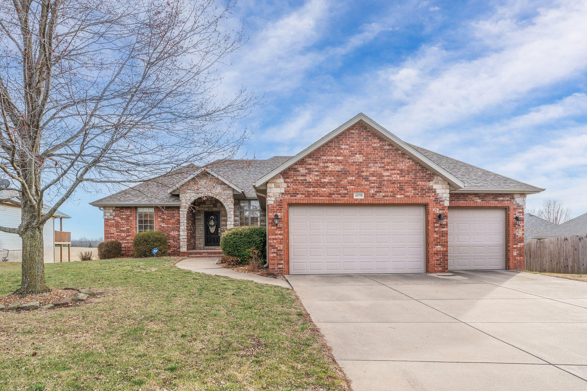 Welcome to your dream home in Pearson Meadows Subdivision within walking distance to Hickory Hills school! This exquisite 4-bedroom, 3.5 bathroom walkout basement home features a custom iron staircase, newer wide plank European white oak flooring, freshly painted walls and cabinetry throughout and newer carpet in basement. As you enter, you're greeted by an abundance of natural light with the 10 foot ceilings and large windows. Statement light fixtures give a sense of elegance and sophistication. The mostly open-concept design adjoins the living room, dining room and kitchen.  The updated kitchen features freshly painted cabinetry with new hardware and stainless steel appliances.The main level features a spacious primary bedroom, complete with a luxurious ensuite bath and huge walk-in closet  There are 2 additional bedrooms that share a Jack and Jill bathroom each with its own vanity. The main level also features a powder bath and laundry room. The walkout basement provides additional living space with living room and wet bar, additional bedroom with full bathroom and two flex spaces that are currently being used as an office and home gym. Step outside to your own private oasis, where you'll find an in-ground pool surrounded by lush landscaping, perfect for relaxing and entertaining on warm summer days. Don't miss your chance to make this stunning property your own. Schedule a showing today!