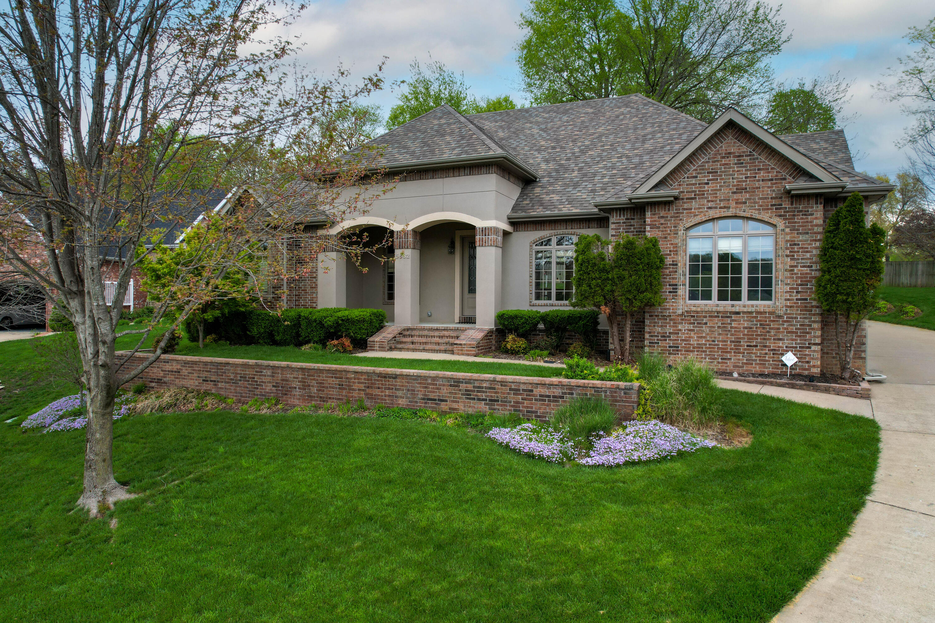 Beautiful one level open floor plan in Rivercut golf community. The grand arched entry way greets you and leads you into the formal dining, office with beautiful built ins, and open living room with two sided fireplace shared with large outdoor covered patio. Large windows overlook the fenced yard including the flower garden and fountain. Kitchen has tons of cabinets and Phoenix marble counters, a bar area that seats up to eight people and pantry. This split floor plan features a huge master suite with sitting area, his and hers walk in closets, large tiled walk in shower, jetted tub and double vanity. Laundry is massive and has a powder room.