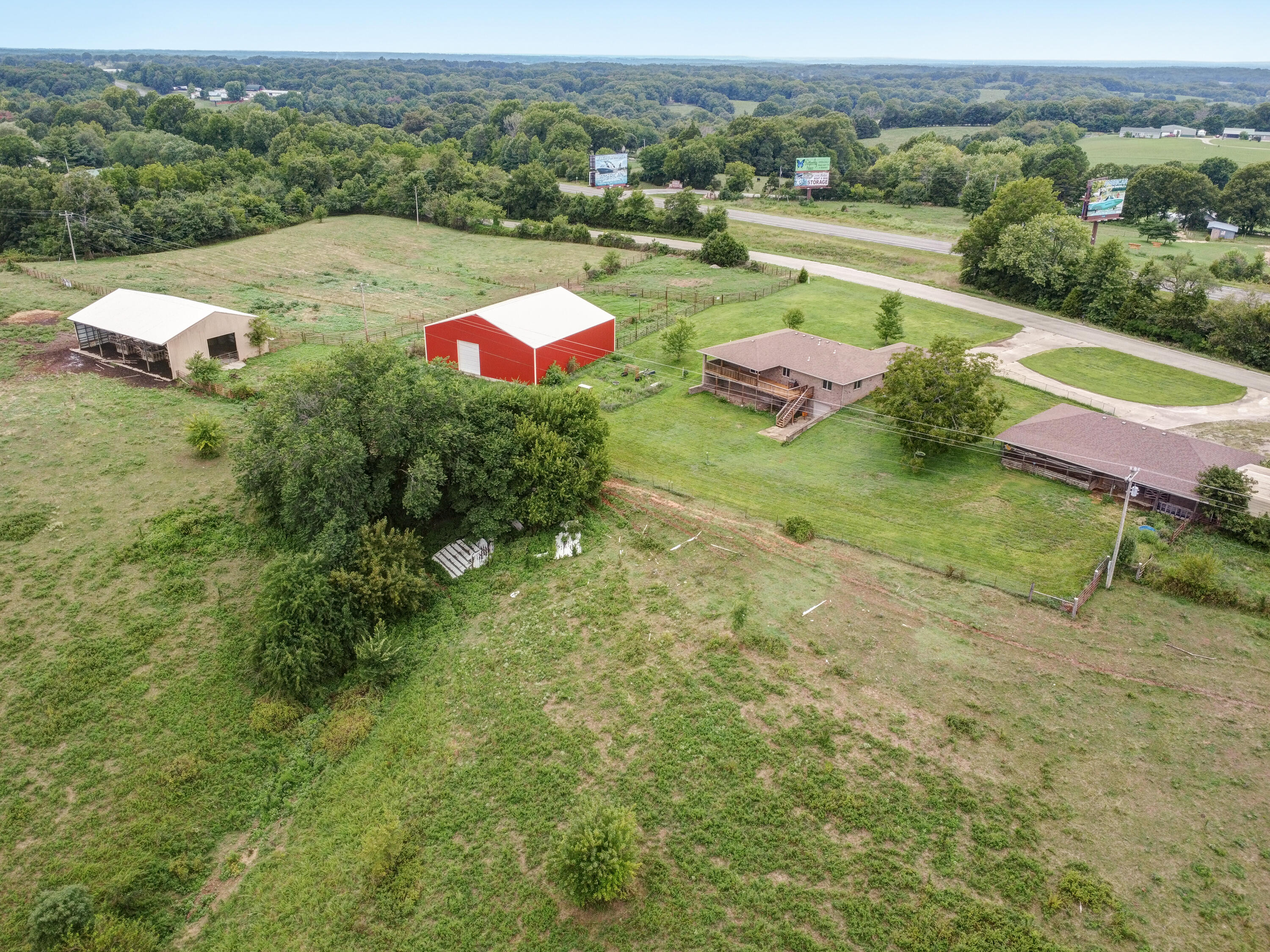 Sellers are motivated - Bring us an offer! Here is a great opportunity to own a 112 Acre farm with an all-brick 3 bedroom, 2 full bathroom home. Features include a full unfinished basement, 60 x 30 all brick shop, 25 x 25 RV covered RV storage, a new 60 x 60 barn, a 50 x 75 second barn, fenced and crossed fenced with steel pen cattle working area. The back of the home has a 44 x 11 covered deck with composite flooring. There is a full unfinished basement with an overhead door, a possible bedroom mostly finished, a huge closed storage area, and plumbed for a bathroom. The shop consists of two huge bays with overhead doors. There are also two horse corrals, a fully-ready chicken coop, a tack room, water and electric are available at the shop. The 112 acres features two ponds, woods and open pasture. The land is bordered on the north by Jonesville Road and the property fronts on Old US State Hwy 160. Located close to Branson West, Table Rock Lake, Silver Dollar City, Branson, and just a short drive to Springfield. HVAC was all new in 2018, water heater has been replaced, Entire upstairs living area was updated in 2018, including granite counter tops, new appliances, all new paint, light fixtures, and all new hardwood flooring, tile, and carpet in bedrooms. Call today to schedule your showing!