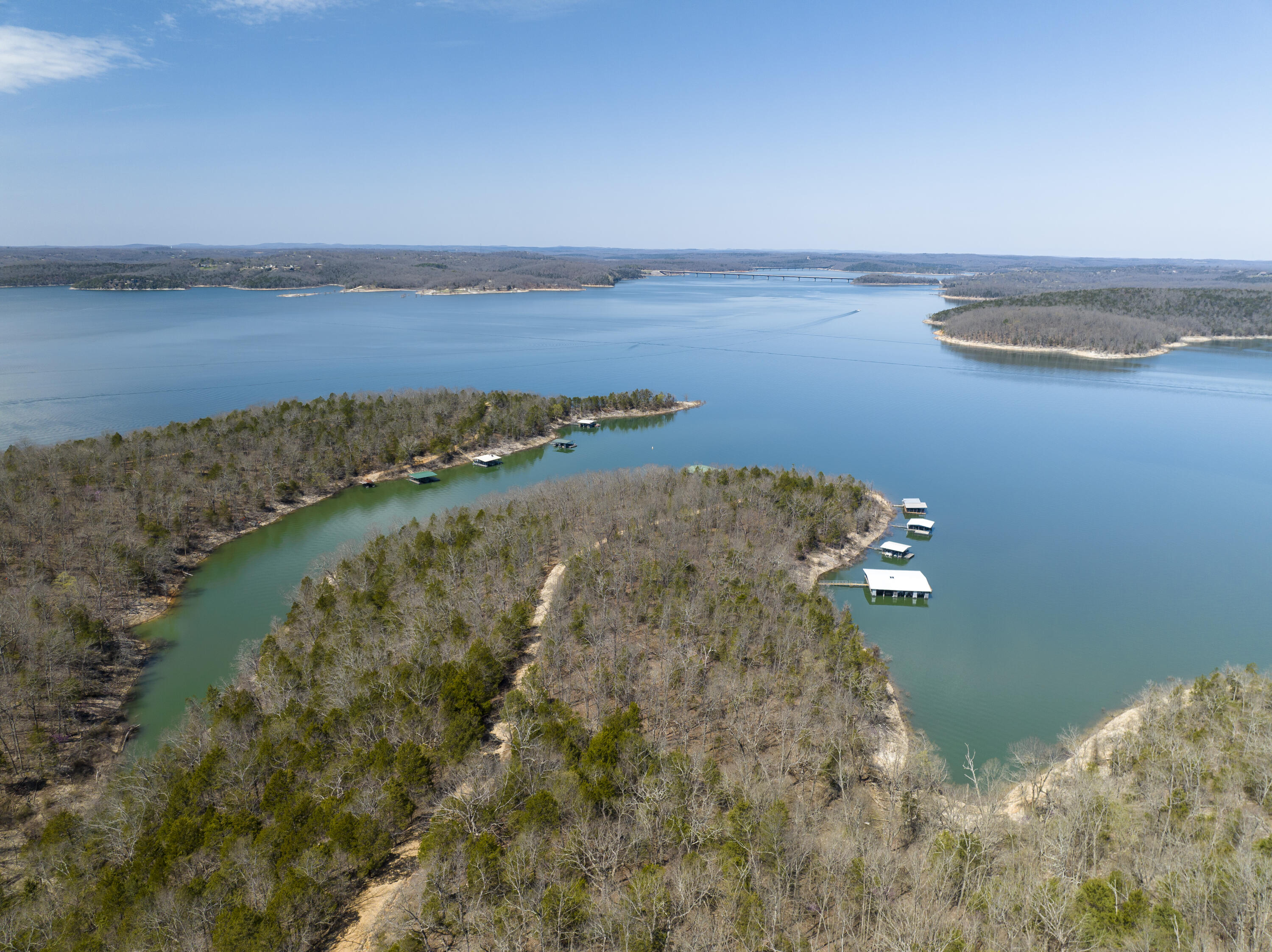 This is the one if your'e looking for JAW DROPPING views of Lake Norfork. It's absolutely the best view of the Major parts of Lake Norfork that is available today. You can see the Dam as well as Both Bridges on top of Flint Knob. What's even better is the access is paved with a grand, gated entrance, fantastic perimeter fencing and incredible roads all through the 168 acres. Did I mention a  private boat dock with 7 slips? This property just goes on and on. Previously planned and surveyed to be a private retreat with condominiums slated on top of Flint Knob, it has never been developed and is waiting for your ideas. Trust me this is ''The Best View on Lake Norfork'' You will not be disappointed.