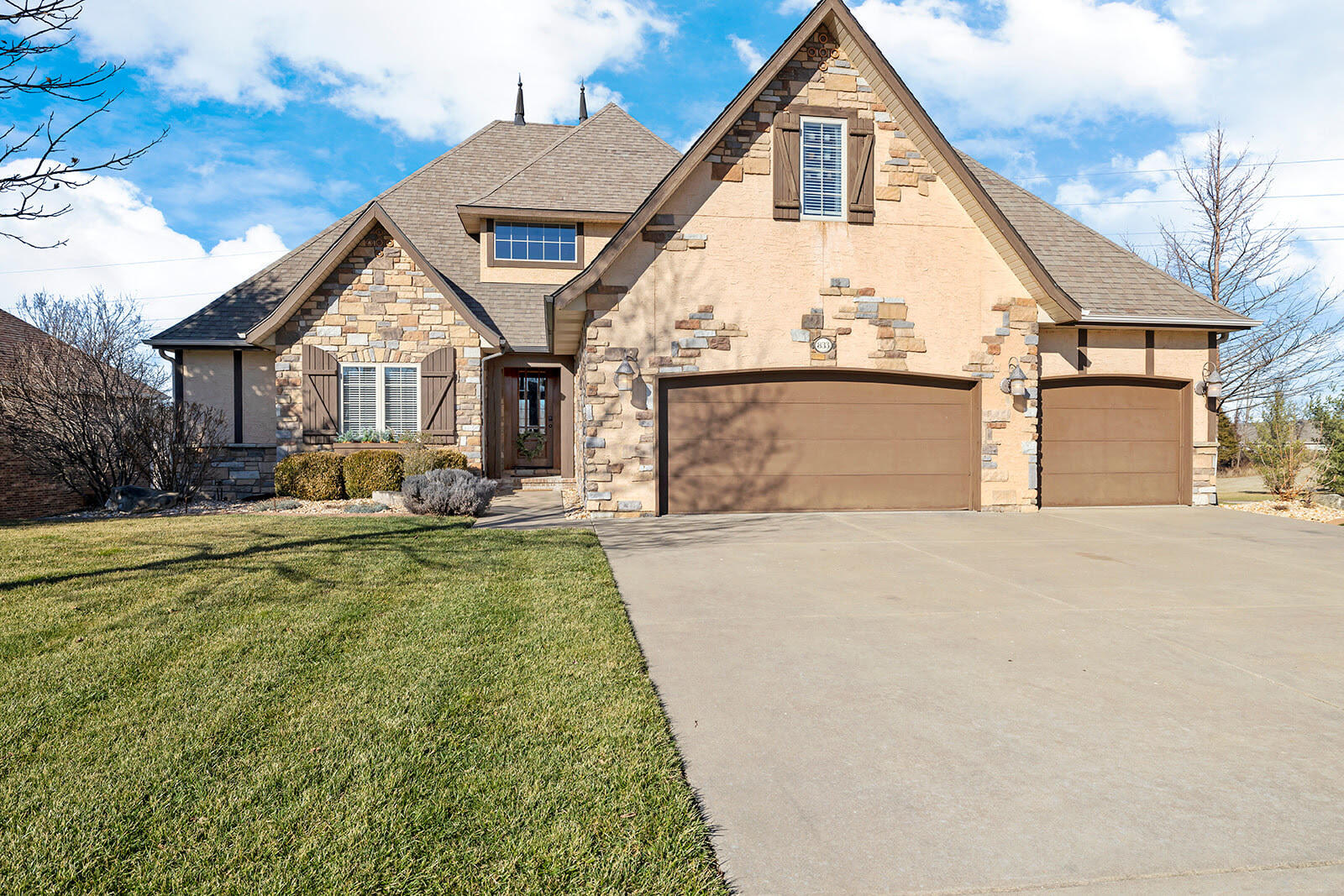 This is the one you have been waiting for.  An absolute stunning walk out basement in the Villages at Wicklow.  You will enjoy the open floor plan that is filled with natural light perfect for entertaining.  In the kitchen is a commercial grade gas range and along with a double oven for the chef in the family.  All stainless steel appliances along with a wine fridge and a huge walk in pantry.  On the ground floor is the oversized master suite, an office or bedroom 2 with an adjacent 3/4 bathroom and the spacious bonus room/guest suite complete.  Step outside to enjoy a relaxing evening in the screened in patio that completes the upper level.  The lower level offers two additional bedrooms, a 3rd full bath, media room, rec room with wet bar, a John Deere room and storage area.  Once outdoors the family will enjoy the in-ground swimming pool, spacious backyard, large patio and a covered deck. Outside comes with a Ecobee thermostat and a sophisticated Rachio irrigation control system both with apps enabling you to control temperature and water from your smartphone.  Two hot water heaters (1tankless), a large 3 car garage and so much more.  Call today for your private showing.