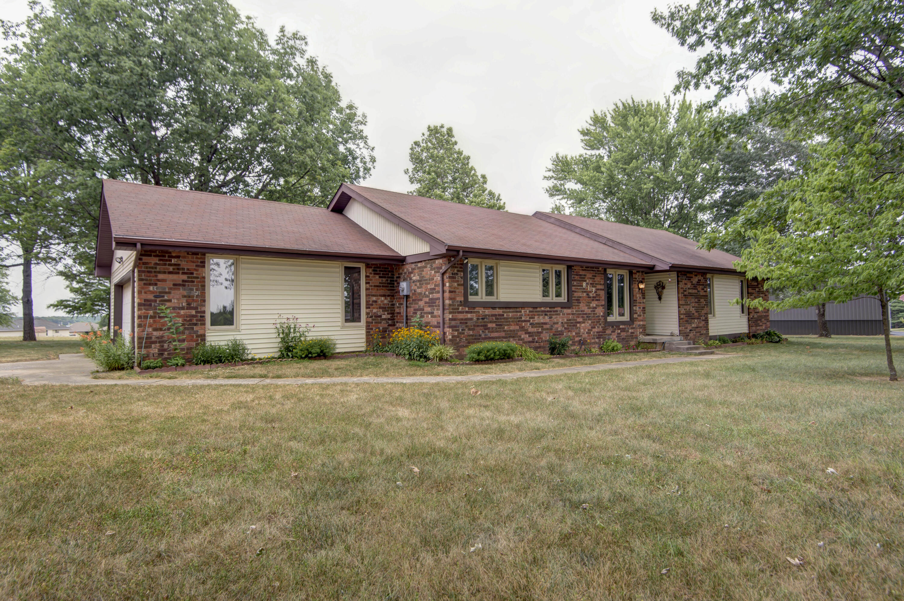 Welcome to this one level ranch style home situated on 3 beautiful acres.This home features 3 bedrooms, 2 bathrooms, and a 2 car garage. It offers a beautiful brick wood-burning fireplace in the living area, exposed wood beams and cathedral ceilings, plenty of counter and cabinet space in the kitchen, large size bedrooms with a dressing area in the master's suite, tons of storage space, big laundry room, and much more! This home is very well insulated, has updated pella windows, and new garage door opener system. You'll enjoy the sense of calmness and serenity as you sit on the back covered deck, watching humming birds and appreciating the lush landscaping. There is an asparagus bed, blackberries, and lots of matured trees that provide shade in the summer.  And don't miss the nice fire pit, which is perfect for gathering and entertainment.This is a very well kept and cared for home with a very short drive to Springfield. Seller is selling AS-IS. Schedule your showing today!