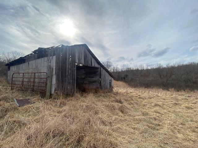 Farm For Sale in the Ozarks! Come take a look at this 93 m/l +/- acres located in the heart of Douglas County! Land is secluded, a mixture of open and wooded, has water, power access, and is perimeter fenced, with some cross fences. Great building spots, and old well spot, an older, nostalgic barn, and views like no other. Come bring your cattle, your building plans, your homesteading dreams, this one checks the boxes with rolling hills, pasture, and woods! Let's go take a look TODAY!