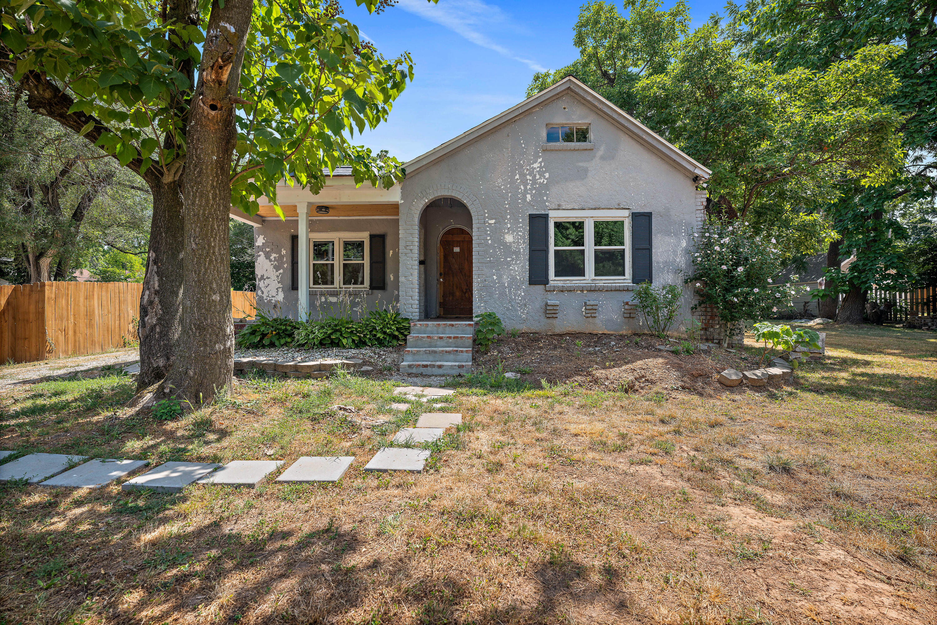 Rare Opportunity.....Location, location, location! Are you looking for an investment or a place where you can make your own design statement? This Mediterranean Bungalow with a unique design is located just two blocks away from Mercy hospital. This partially fenced yard has an outdoor brick fireplace oven, making it a nice place to enjoy a relaxing evening. Everything is stripped down and awaiting a brand new finish. Sits in the Original 'SUNSHINE PLACE, LOTS 1 & 2 ' Neighborhood located in the heart of Springfield. You must see this home to appreciate its potential!