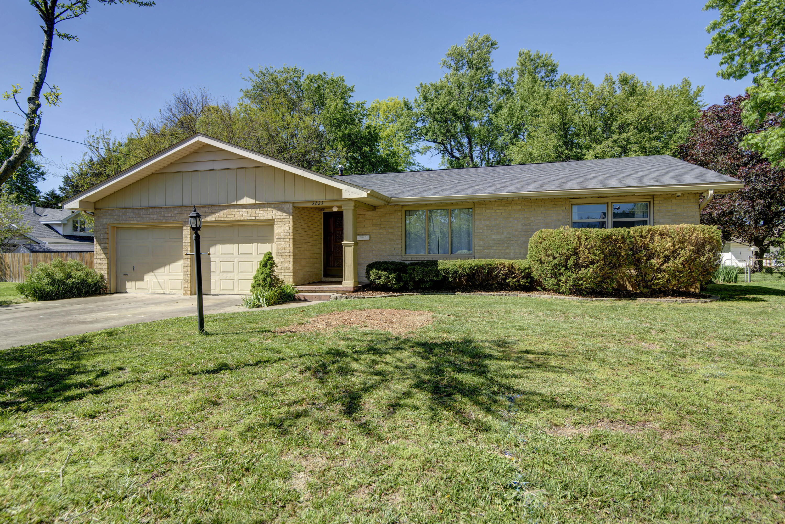 Come and see this beautiful home located in a beautiful neighborhood.  Spacious bedrooms with original hardwood floors.  You will love to entertain in this lovely living room with large picture window and family room that opens up into to updated kitchen with granite countertops, movable island and under cabinet rechargeable lighting.   Seller has installed solar tubes in kitchen, Family Room and Master bathroom for extra light. Sunroom at back of house opens up into a park like back yard with raised beds, perennial shrubs and flowers.
