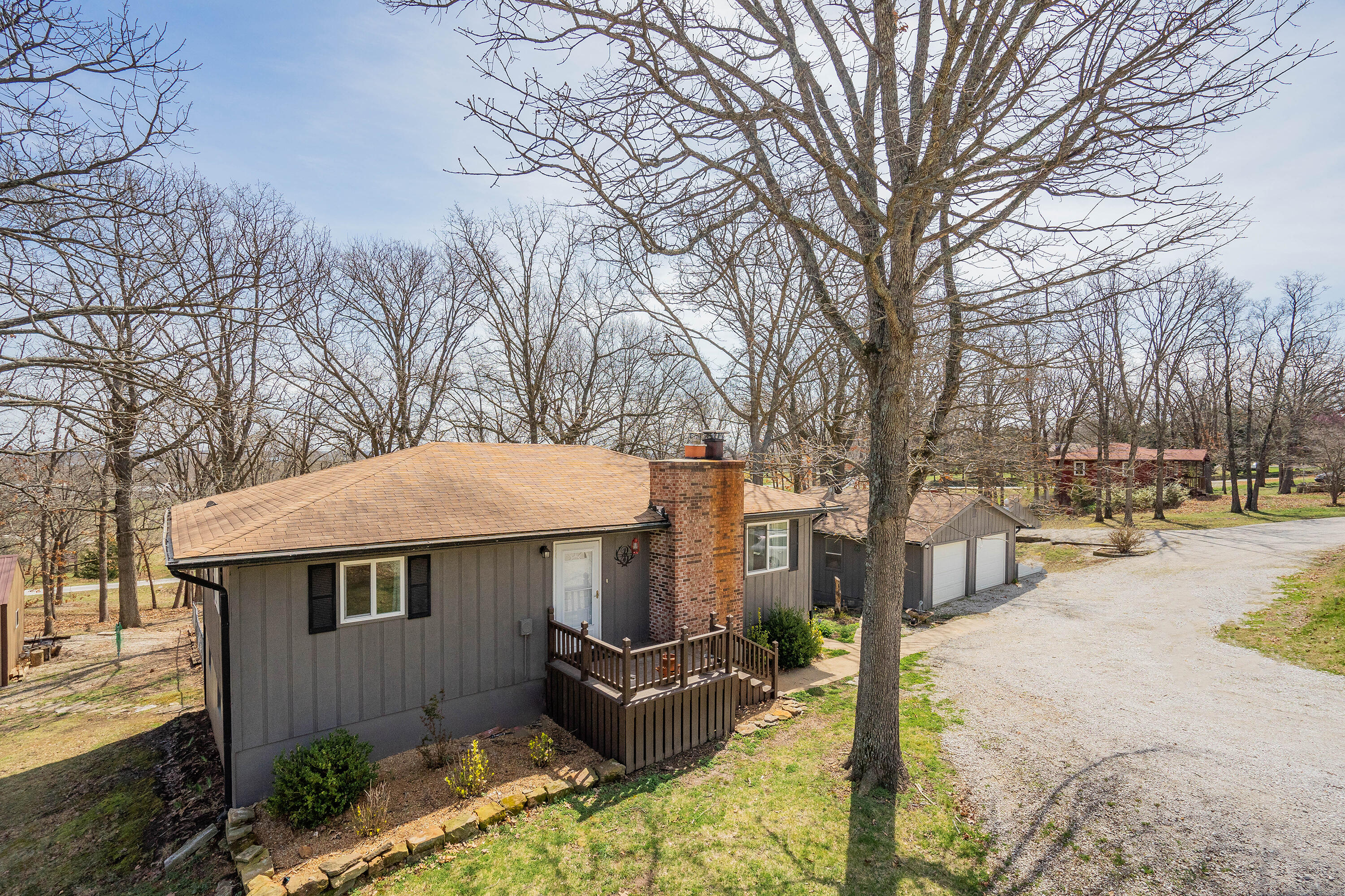 Don't miss this opportunity to own this beautiful home close to Stockton lake. Community boat launch less than a mile away! On almost an acre, this property is in a park like setting and on a dead end street. Inside you'll find vinyl plank in the kitchen, along with a custom ,island with butcher block. The deck off of the kitchen is perfect for entertaining and taking in the peace and quiet! The basement has so much character, and walks out to a fenced back yard with plenty of room for the kids, pets, or get togethers. The detached 20 x 30 shop is perfect for storage or a nice workshop. Updates include: front entry flooring, new paint, new casings on the doors and windows and baseboards upstairs, custom island, hard wired with a butcher block top, French doors, and many more. Hurry before this one is gone!