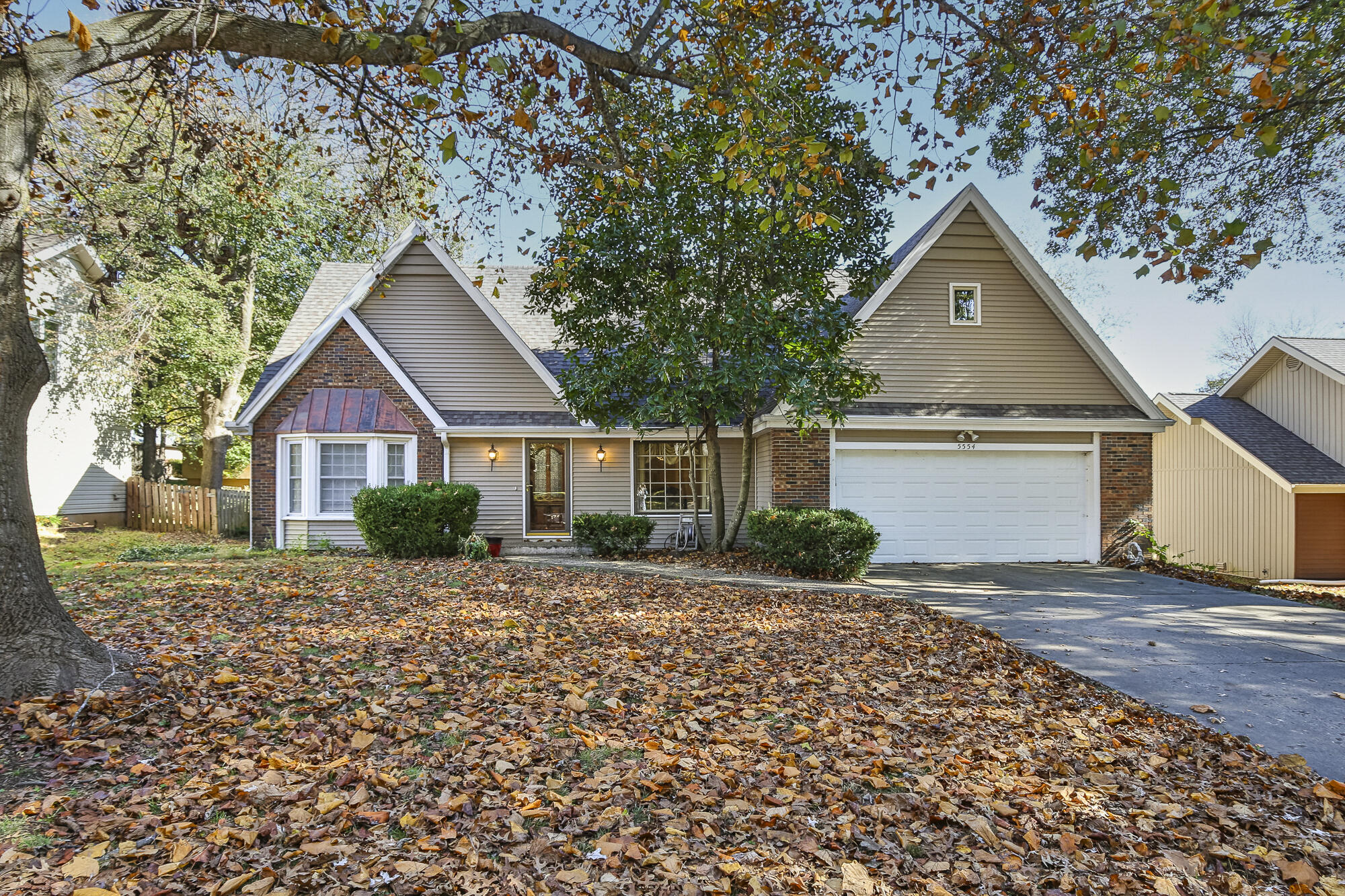 This delightful home boasts a picturesque cottage-style exterior, setting the stage for an inviting living experience. Inside, you'll be greeted by soaring, beamed ceilings that create a sense of space and warmth.The sunny breakfast nook and updated kitchen, complete with granite countertops and stainless steel appliances, make for the perfect spot to start your day.Step outside onto the large deck, ideal for entertaining, and take in the delightful features and a fully fenced backyard for your privacy and enjoyment.The main level hosts the primary suite, featuring a spacious walk-in closet, double vanity, a newly updated walk-in shower, and heated tile floors for your comfort.Upstairs, you'll find two generously sized bedrooms and a full bath to accommodate your family and guests.Conveniently located in the sought-after southwest area, you can walk to Cherokee Middle School, making it ideal for families.Additional features of this home include a newer roof, two HVAC units for climate control, a formal dining area for special occasions, an unfinished attic area for storage or future expansion, and new siding and gutters to enhance its curb appeal.This home is a true gem, ready to offer comfort, style, and convenience. Don't miss the opportunity to make it your own!