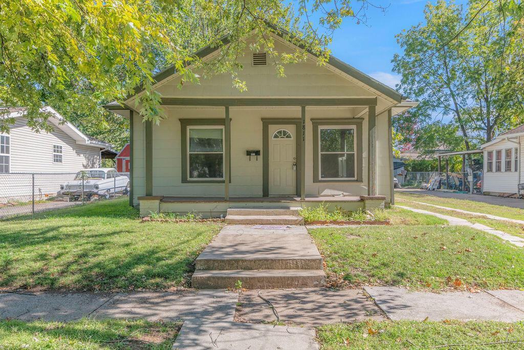 Cute bungalow in the heart of Joplin! The welcoming front porch is perfect to enjoy a nice cup of coffee or just relax on this picturesque tree-lined street. Newer flooring & windows, updated baths and a large fenced yard round out the wonderful amenities this home offers. Check it out today!
