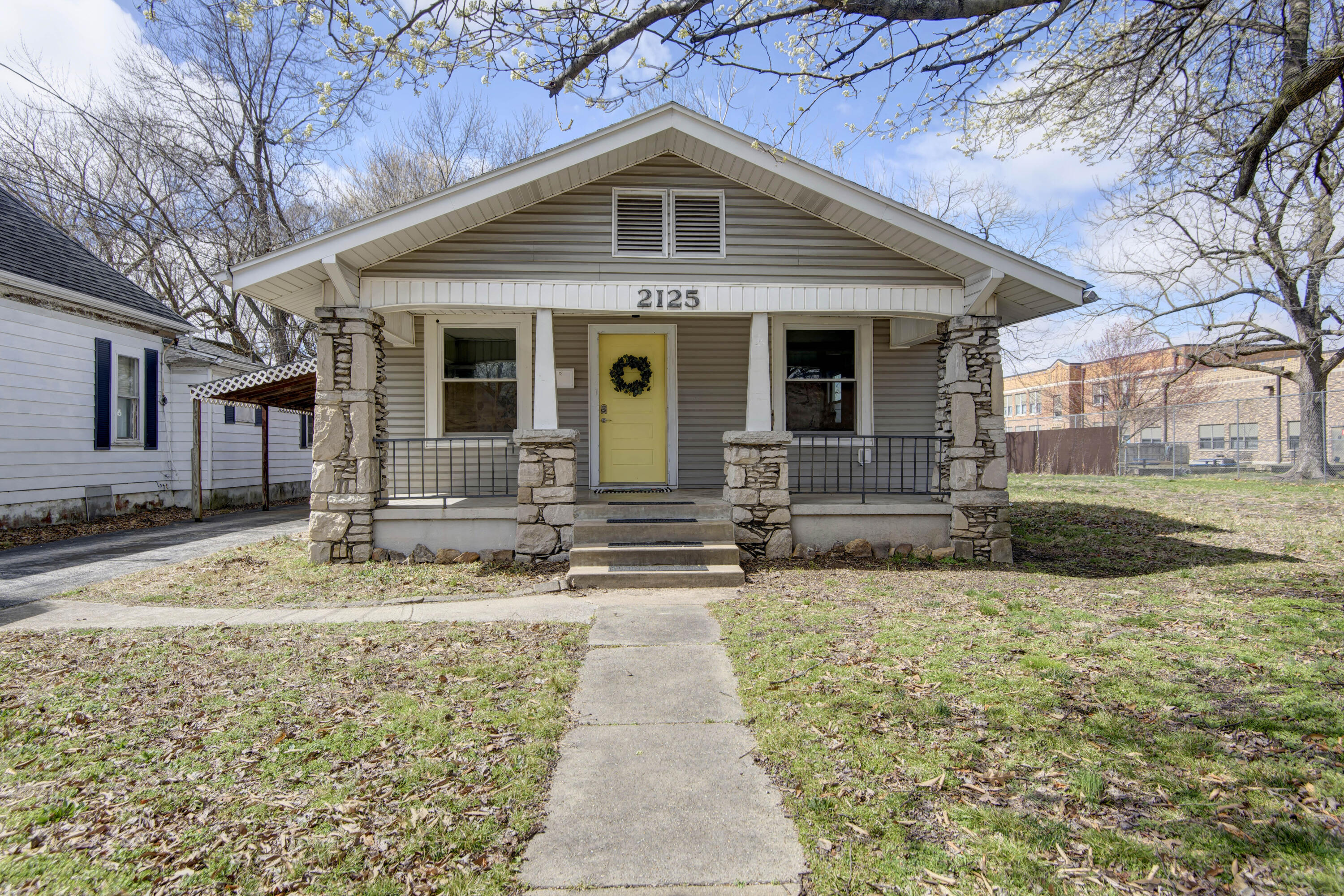 This beautifully remodeled bungalow is a true gem! Step inside and be greeted by a warm and inviting living room with the larger bedroom and bathroom straight ahead. The bathroom comes equipped with double sinks, modern fixtures and finishes as well as a large walk in tile shower. To your right is the spacious dining area complete with plenty of natural light and ample room for hosting. The kitchen features newer appliances, stunning cabinetry, and sleek countertops. Need a little extra space? The laundry room is laid out with potential for more shelving and storage. The back bedroom is perfect for a bonus room or home office, providing the flexibility to create the ideal living space. The spacious back yard is fully fenced in while the covered front porch and back deck provide additional space for relaxation and entertainment. This home has been updated over the last 3 years and boasts newer electrical, flooring, insulation, fixtures, dry wall, plumbing and windows. Don't miss out on the opportunity to make 2125 N Grant your new home! Schedule a tour today and experience the perfect blend of modern updates and classic charm.