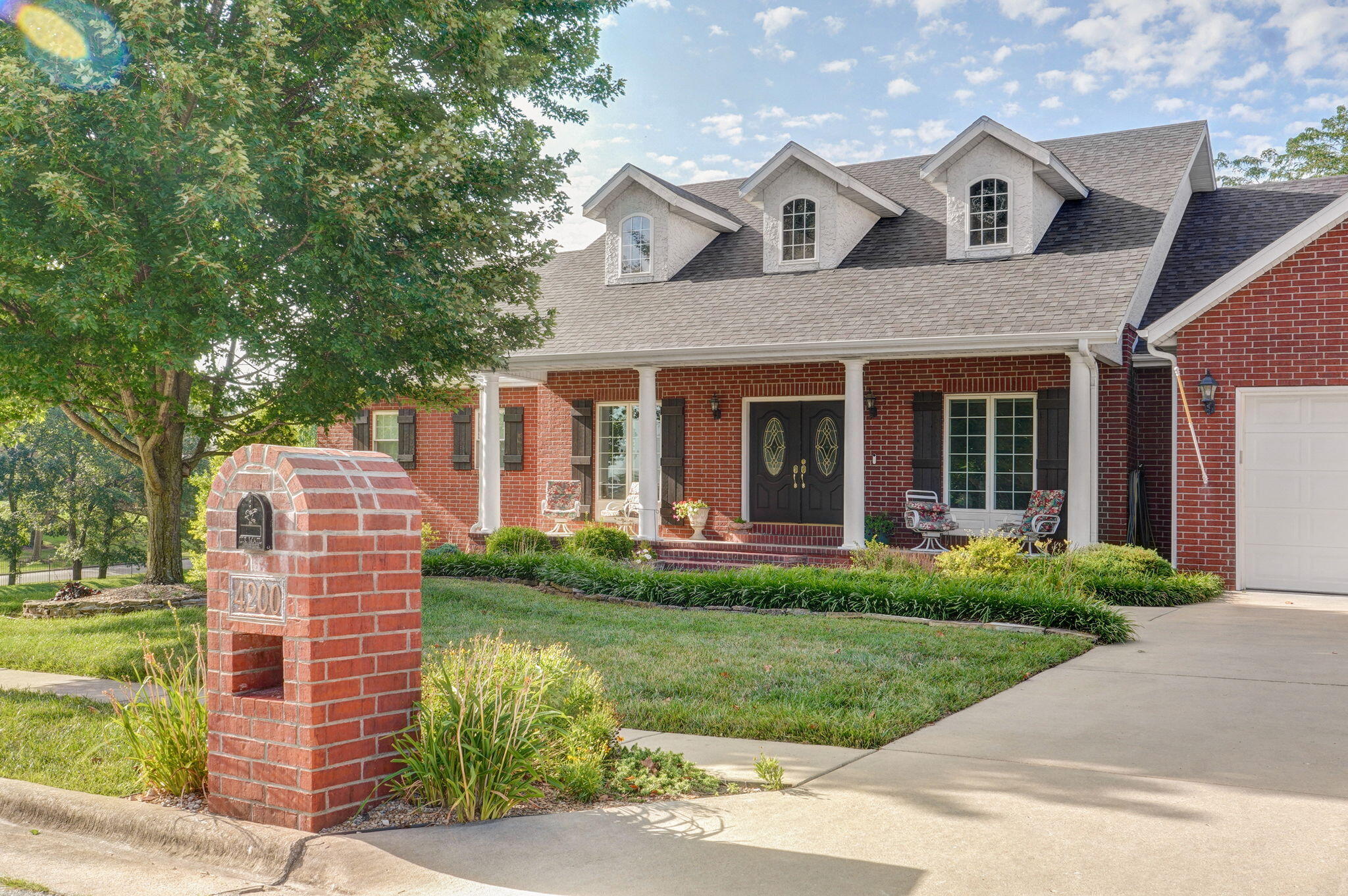 Open House Sunday, August 6th 2-4pm Welcome to Fair Haven Estates. Great location and great schools. This beautiful all brick walk out home sits at the end of the street and backs up to a cul de sac. The side yard is adjacent to Fremont Hill golf course. You will love the privacy.  The landscaping is spectacular. It's truly an outside haven complete with a fire pit. The roll down shades are a nice addition to the covered deck. From the moment you step inside you will fall in love with the soaring ceilings, new hardwood floors, floor to ceiling rock fireplace, granite counters and black appliances. The living space is perfect for entertaining with a serving bar and space for a large table. Lots of cabinets and a walk in pantry.The master suite, laundry room, additional bedroom, full  bath and powder room are on the main floor.Downstairs is another full kitchen, large family room with a pellet stove. recreation room, large storage/storm shelter room, full bath, 3 other bedrooms, 2nd laundry room with utility sink, and a John Deere room.The hot tub on the outside patio and the pool table in the recreation room are negotiable.This home is perfect for a family and if you need mother in law quarters.The home has been loved and cared for. You will want to see it to appreciate it.