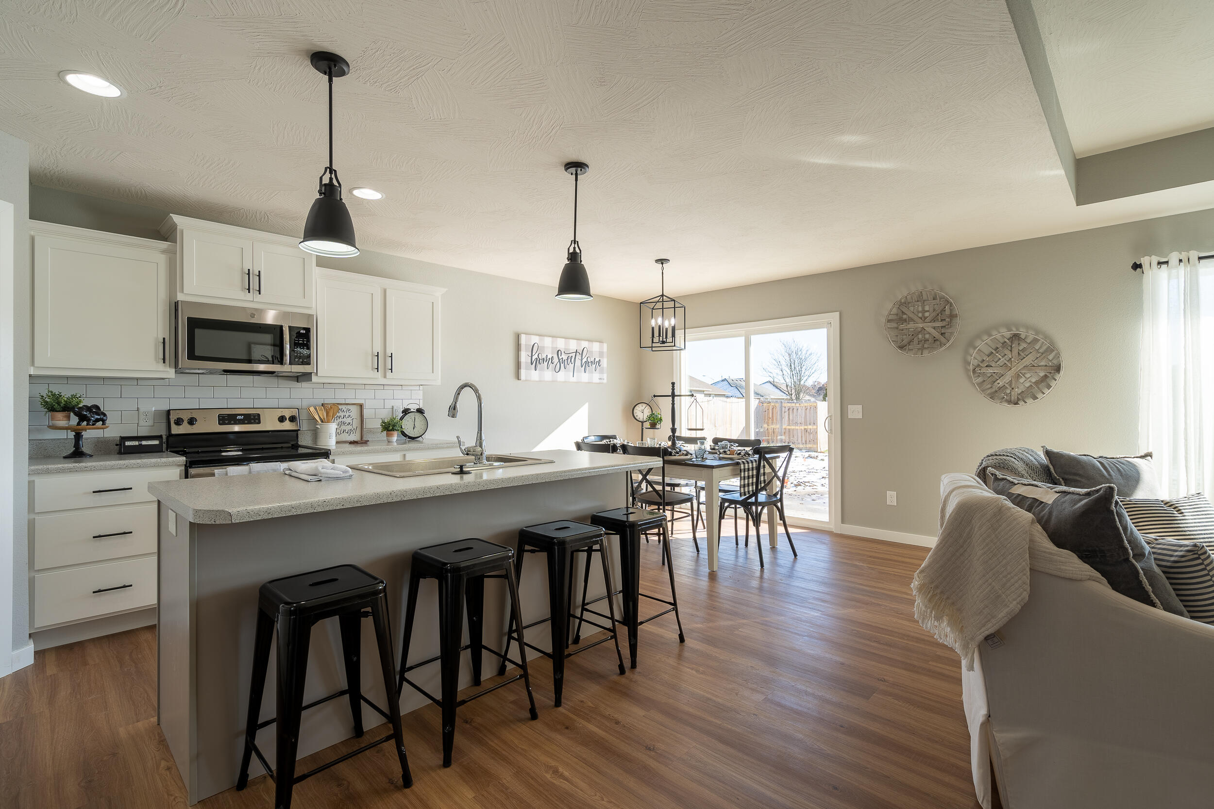 The single-level Charleston model offers three bedrooms-each with walk-in closet-and two full baths. An island Kitchen with walk-in pantry open to the Dining Area and Living Room makes for easy entertaining and enjoyable family time.