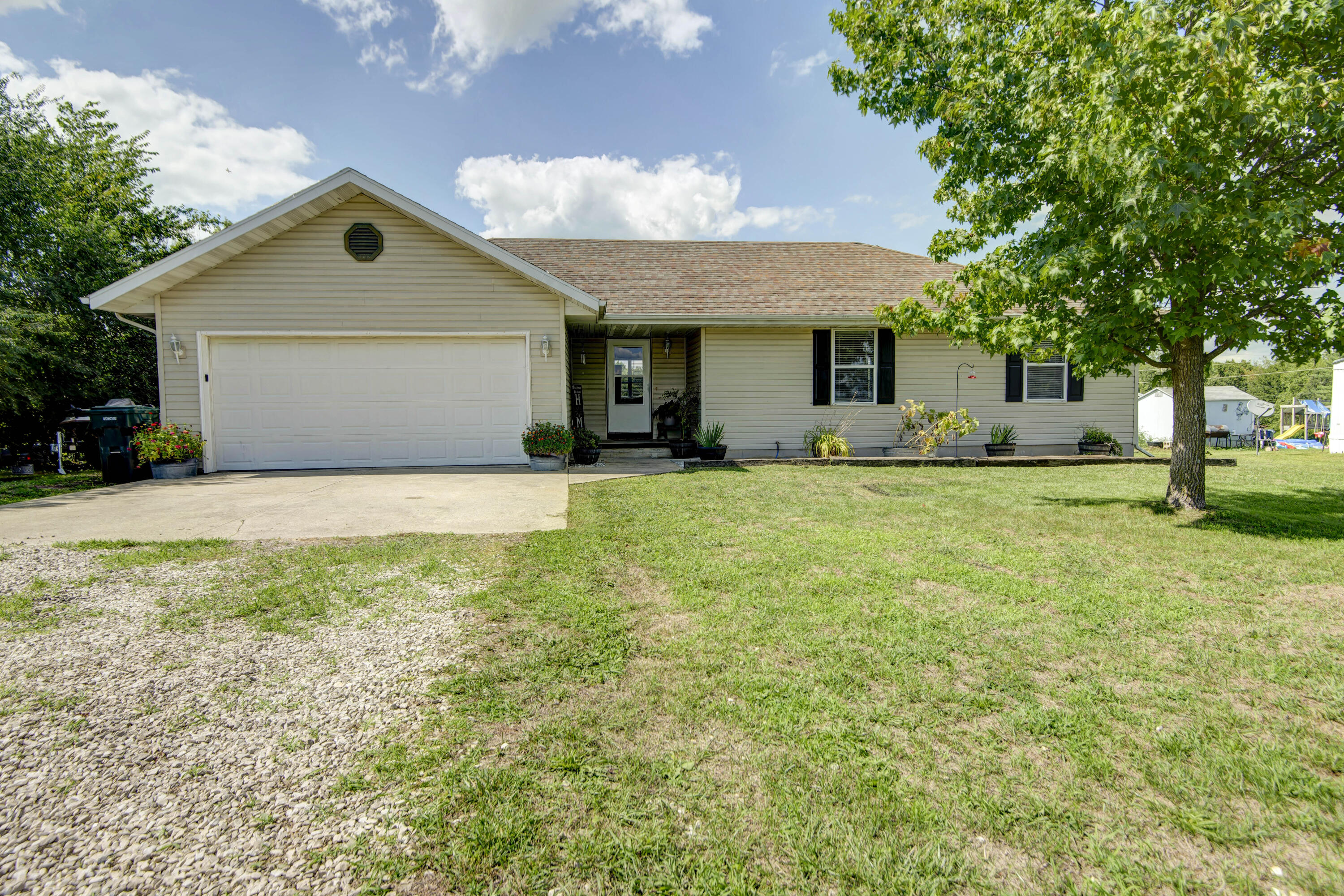 Take a look at this Move in Ready 3bd 2 bath home sitting on 1acre of land outside city Limits with paved highway frontage and just 1 mile from 60 highway. Lots of New updates All New Interior Doors, hardware, New Carpet in all 3 bedrooms all New interior paint, nicely painted Kitchen Cabinets and bathroom cabinets, New Appliances include stove, dishwasher, and a garbage disposal, there is a nice size back Deck, a great space for entertaining and barbequing. The large back yard is fenced and cross fenced, and currently holds a pony and a few little goats, it has a large outbuilding at the back of the lot that is the perfect place to keep your hay and feed. Hey ladies, there, is a poured concrete slab out back waiting for you to build your She Shed OR if he insists a Man Cave will do :)You don't want to miss this little gem
