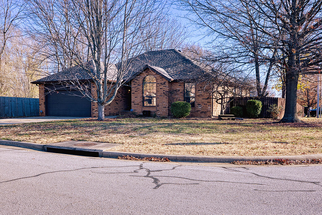 Wonderful 3 bed, 2 full bath home in Kay Pointe Subdivision! This property sits on a corner lot and has fresh paint, new flooring, NEW ROOF, gutters, guards and skylight.Inside, discover a living room with gas fireplace and no carpeting.  The kitchen features an attached dining space, painted cabinets, bar seating, includes all appliances and has a laundry area with doors and pantry.  The primary suite has high ceilings and walk-in closet.  Both bathrooms have new granite countertops, mirrors and cabinets.  Refrigerator in kitchen & garage both stay.Outside, enjoy a covered deck and full privacy fenced yard. With easy access to Kansas Expy, Sunshine and in Willard Schools, this home is sure to impress!  An added bonus is the completely encapsulated & lighted crawlspace that is temp/moisture controlled.  The 4 exterior hardwired cameras stay and require no service agreement. This well kept neighborhood includes a pool, tennis courts & pavilion. Call us today for your private tour!
