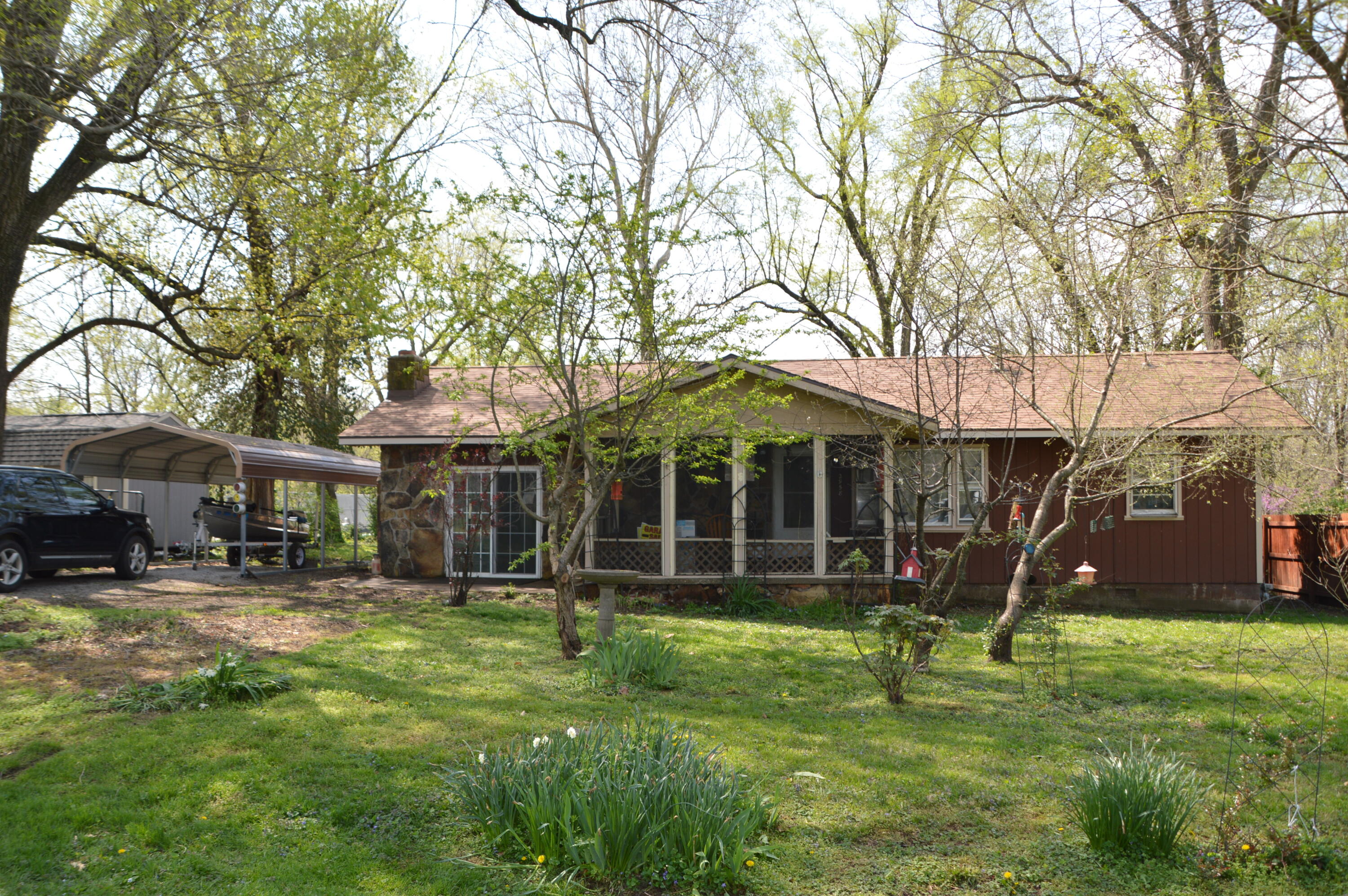 Hard to find 3 Bedroom/1 Bath home with Carport and beautiful spacious yard.  New roof, central Heat & Air, wood burning fireplace in 3rd Bedroom/possible 2nd living area.  Newer carpet, screened porch, deck and mostly fenced yard with lots of nice perennial plants. Hurry this one won't last.